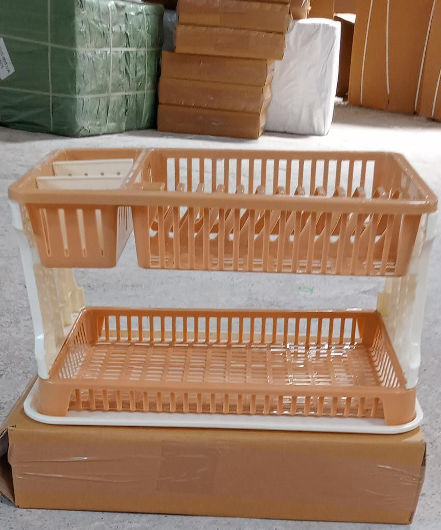 Efficient kitchen dish organizer with drainable tray.