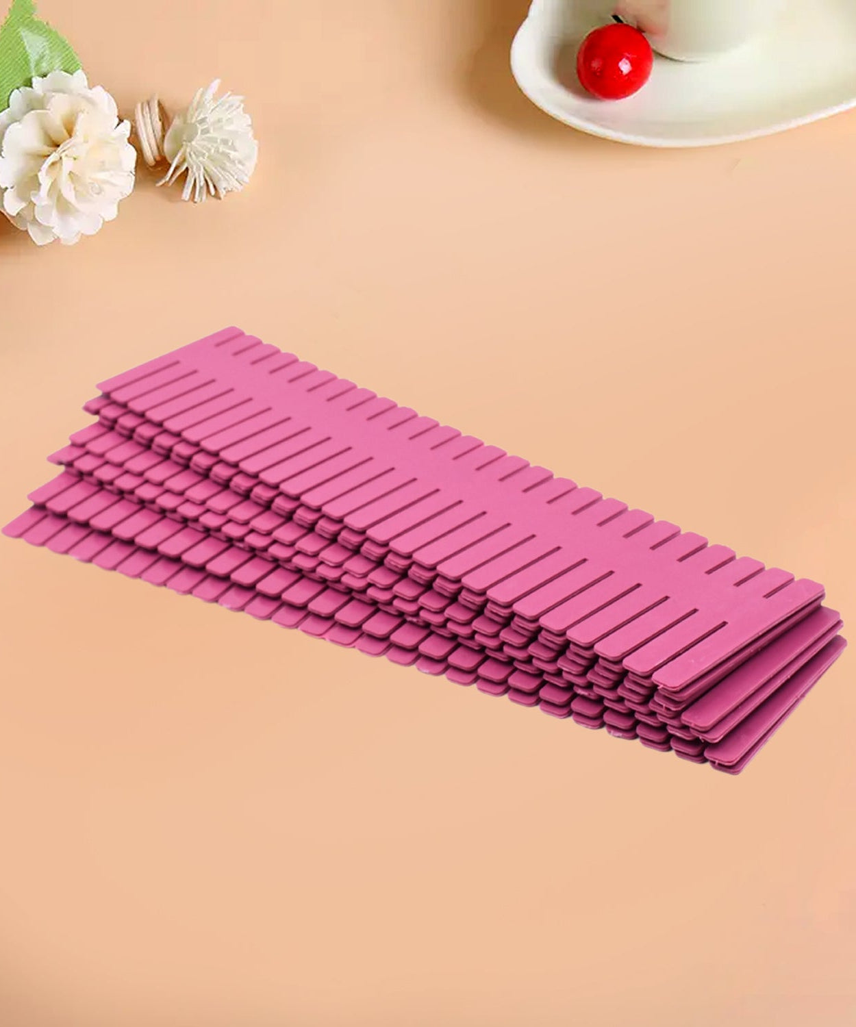 Plastic grid drawer dividers, adjustable for custom organization in home and kitchen drawers.