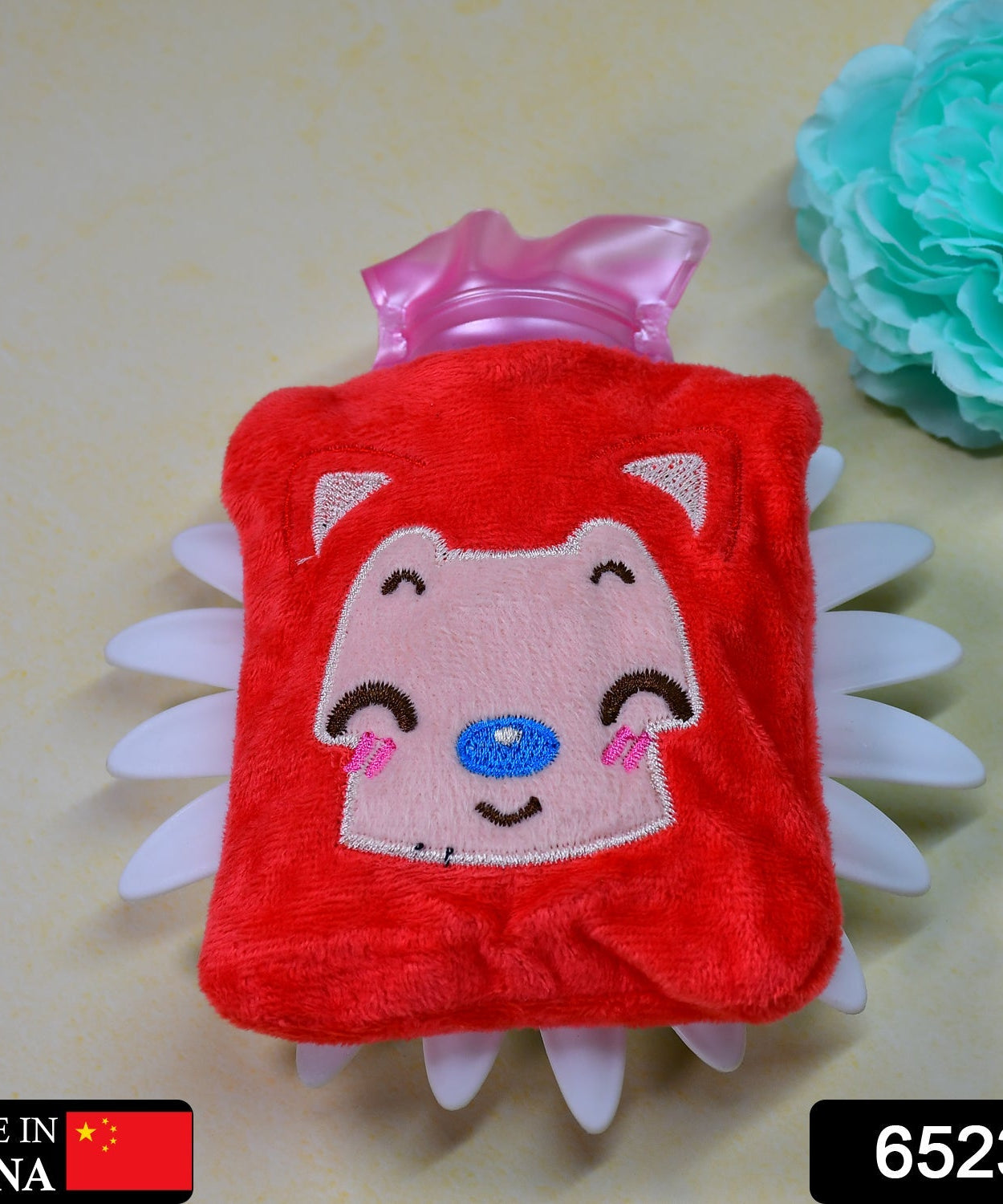 Hot water bag in pink cat design for relieving neck and shoulder pain