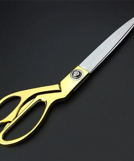 Sharp stainless steel tailoring scissors for professional use.