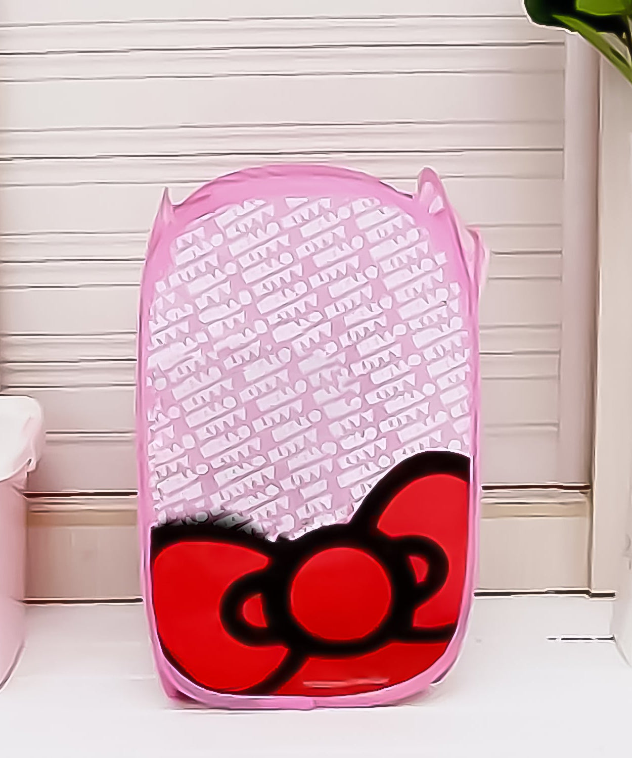 Waterproof canvas laundry bag with stylish print for home organization.