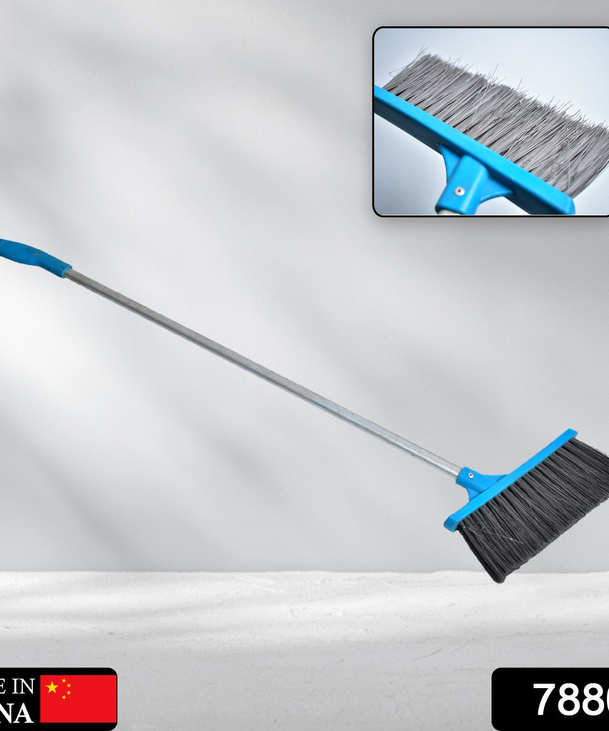 Stiff-bristle scrub brush with long handle, ideal for cleaning bathroom floors and tiles.
