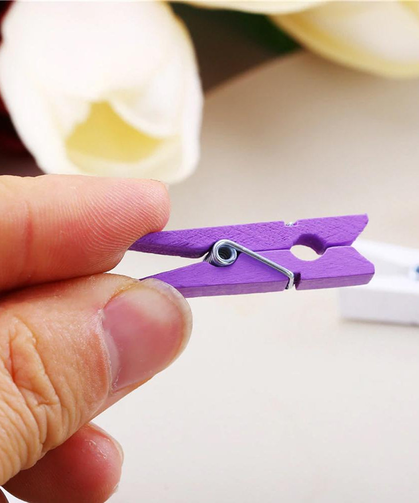 Decorative wooden clips for hanging photos, includes 50 clips