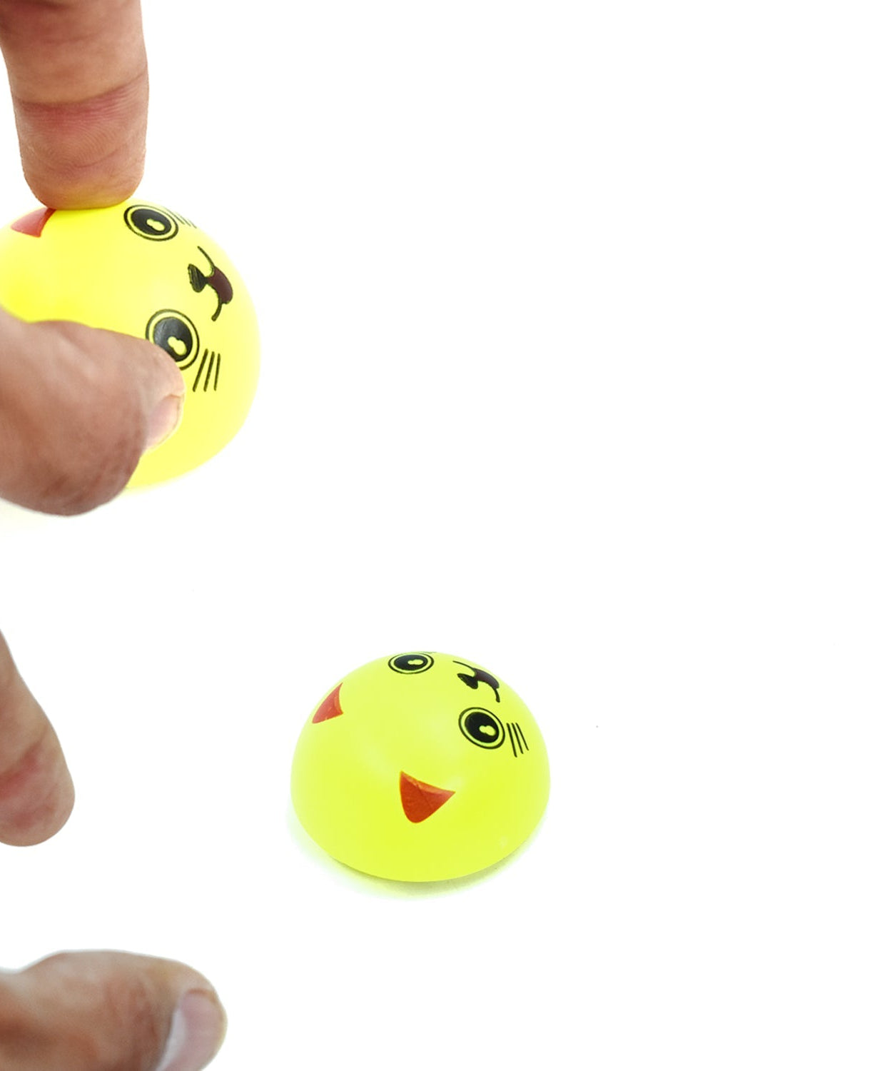 Smiley toy with pull back feature