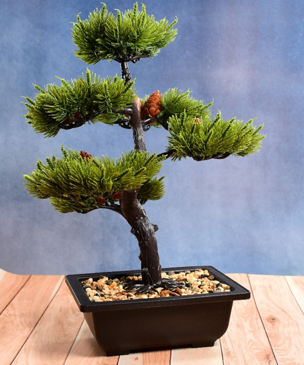 Artificial potted plant in a square white pot