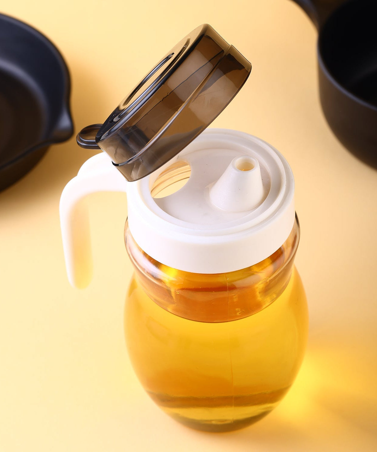 Steel oil bottle with easy pour spout.