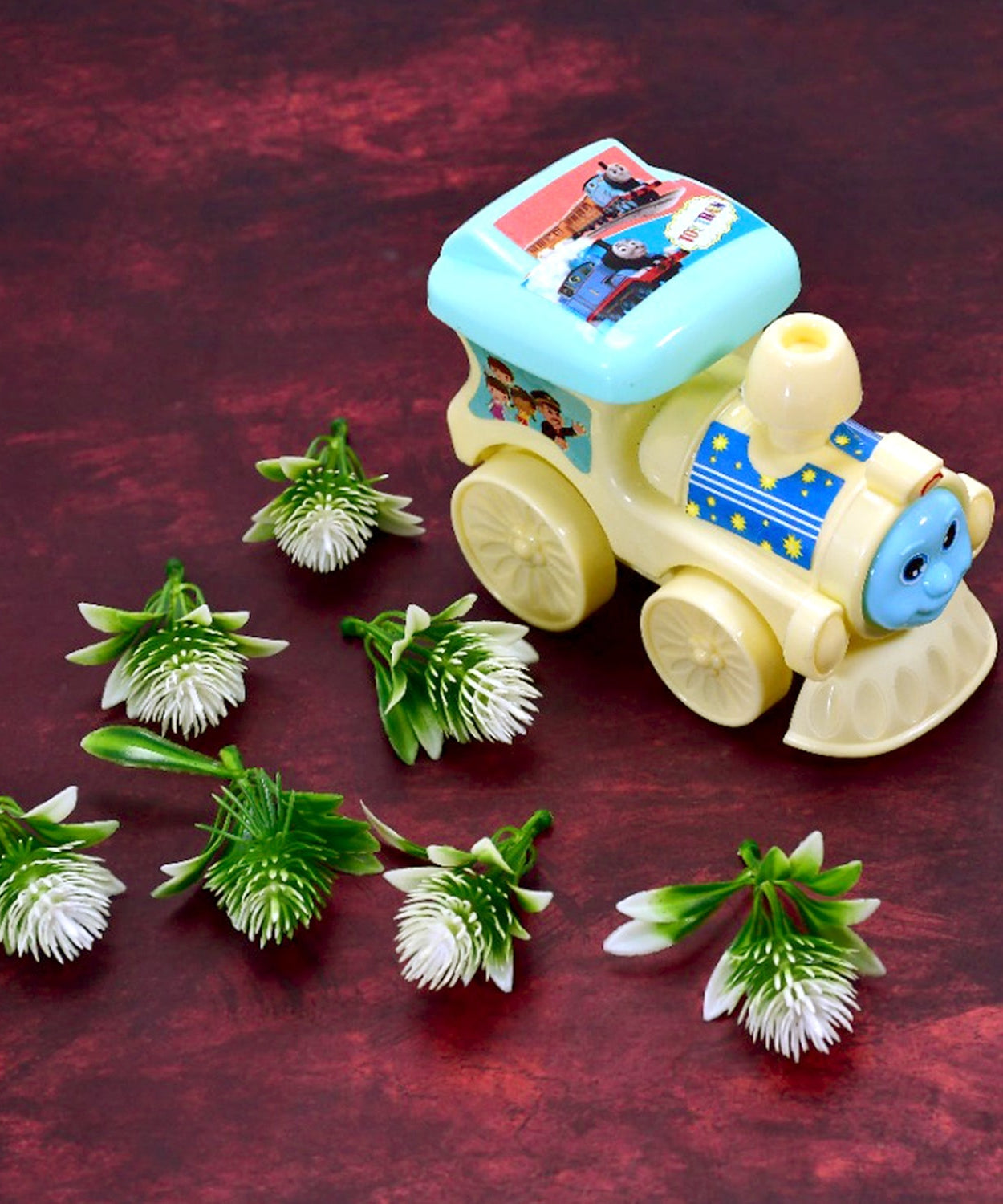 Toy train with pull-rope feature.