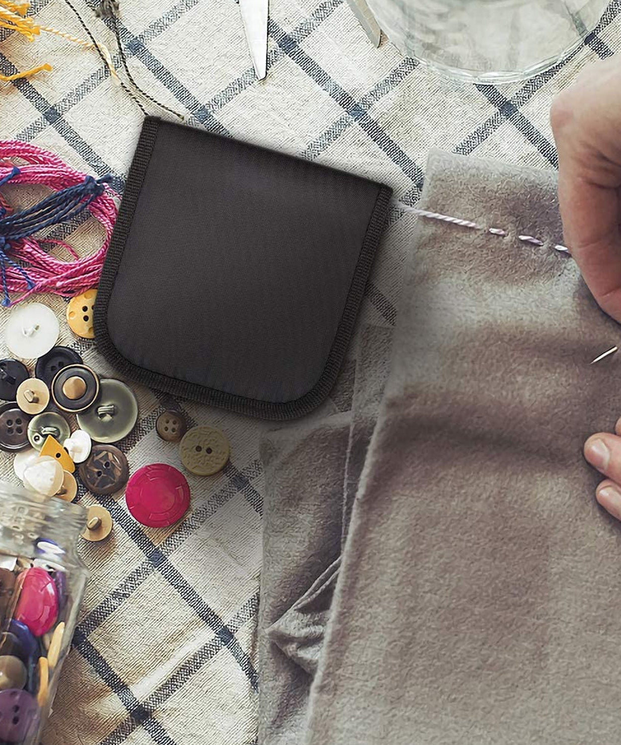 Portable 48 Pc sewing kit for quick clothing repairs and crafting.