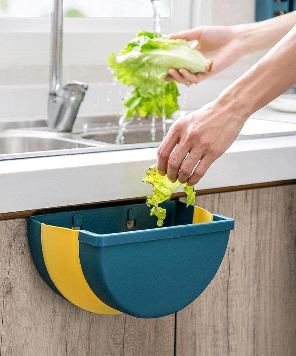 Space-saving wall-mounted trash can with adhesive hook.