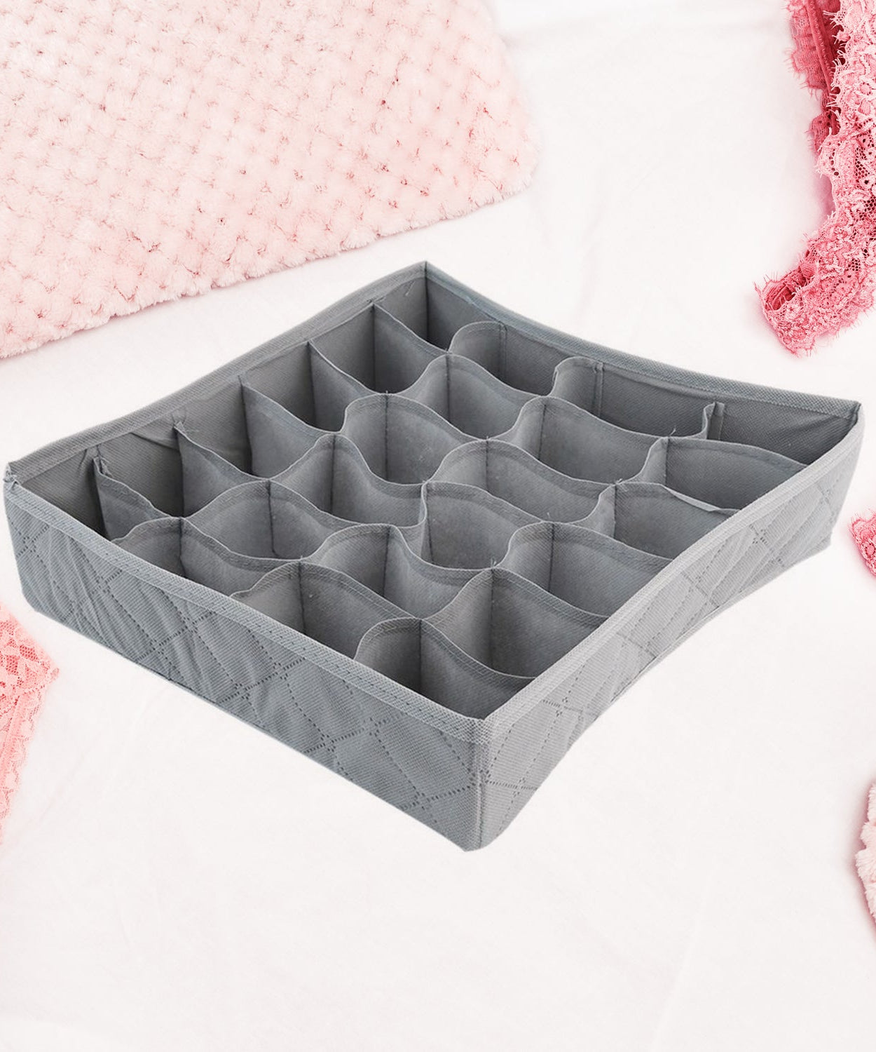 Folding storage box for ties, socks, and handkerchiefs.