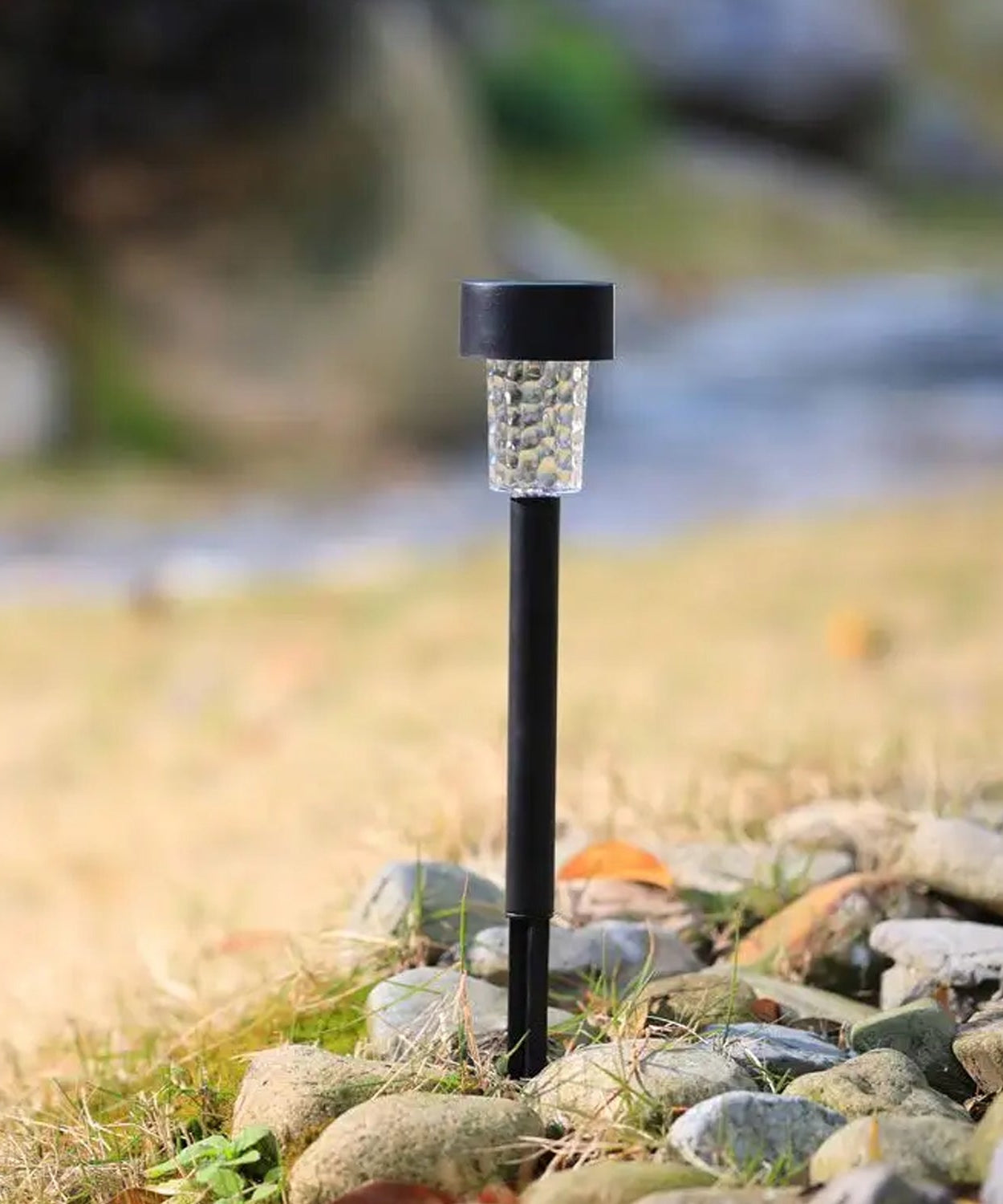 Solar LED spike light for garden, yard, or path with waterproof design.