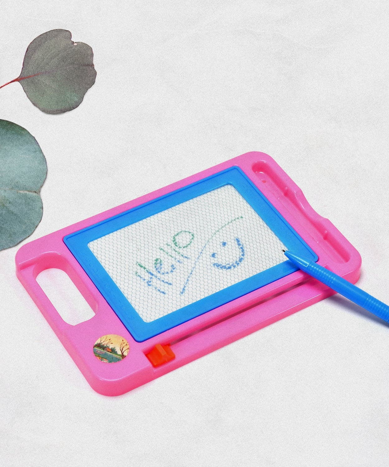 Magnetic slate toy with pen, writing surface