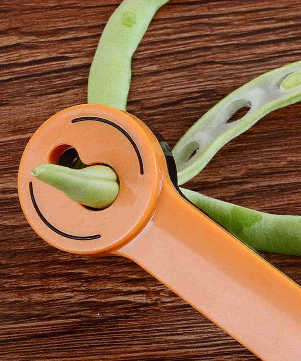 Quick bean slicer and peeler for effortless vegetable cutting.
