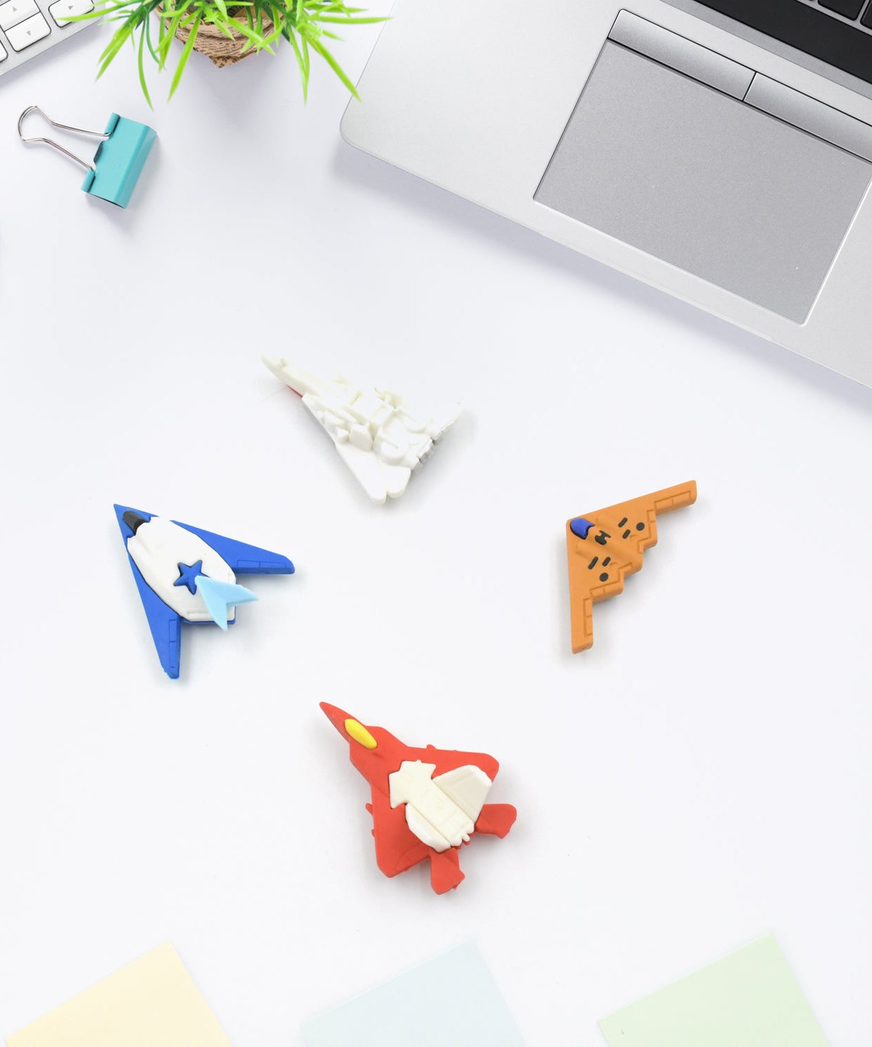 Assorted erasers in playful gun and plane designs