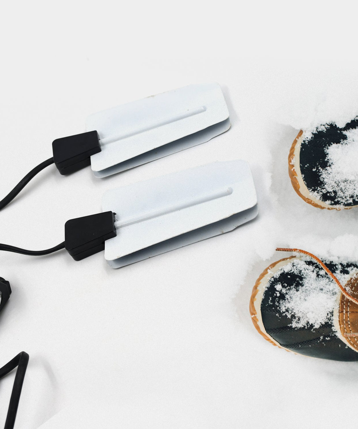 Electric shoe dryer with USB and timing features, portable for various settings.