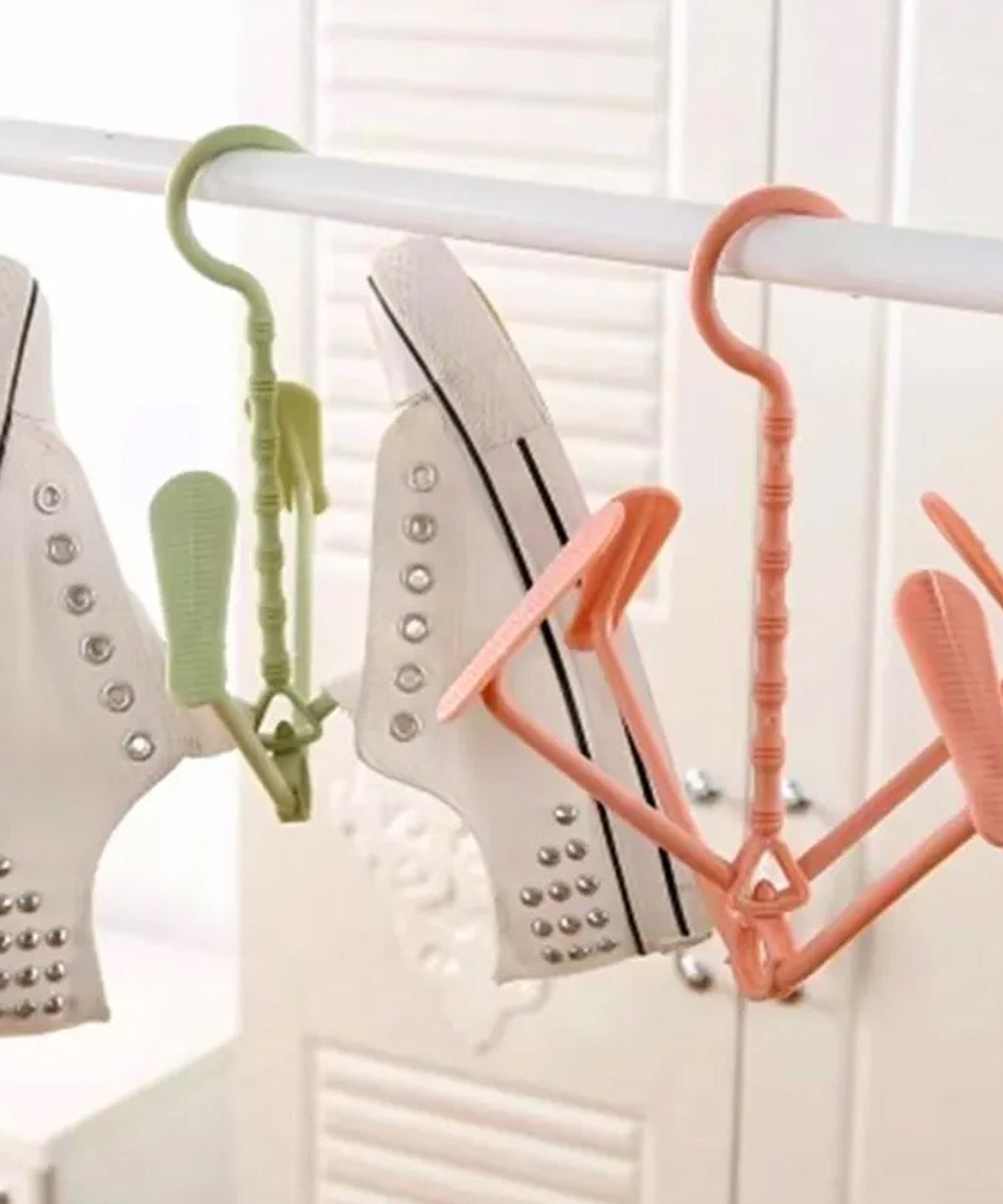 Drying shoe rack with rotating hooks, dual-use for wet and dry shoes.