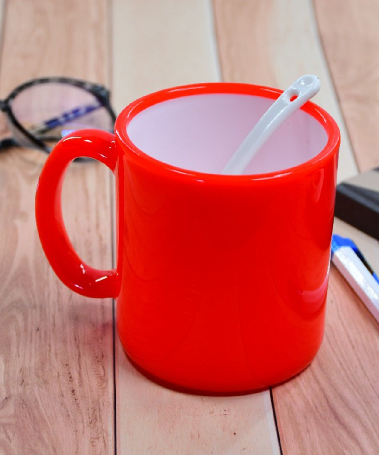 Colorful coffee mug with mixed design patterns.