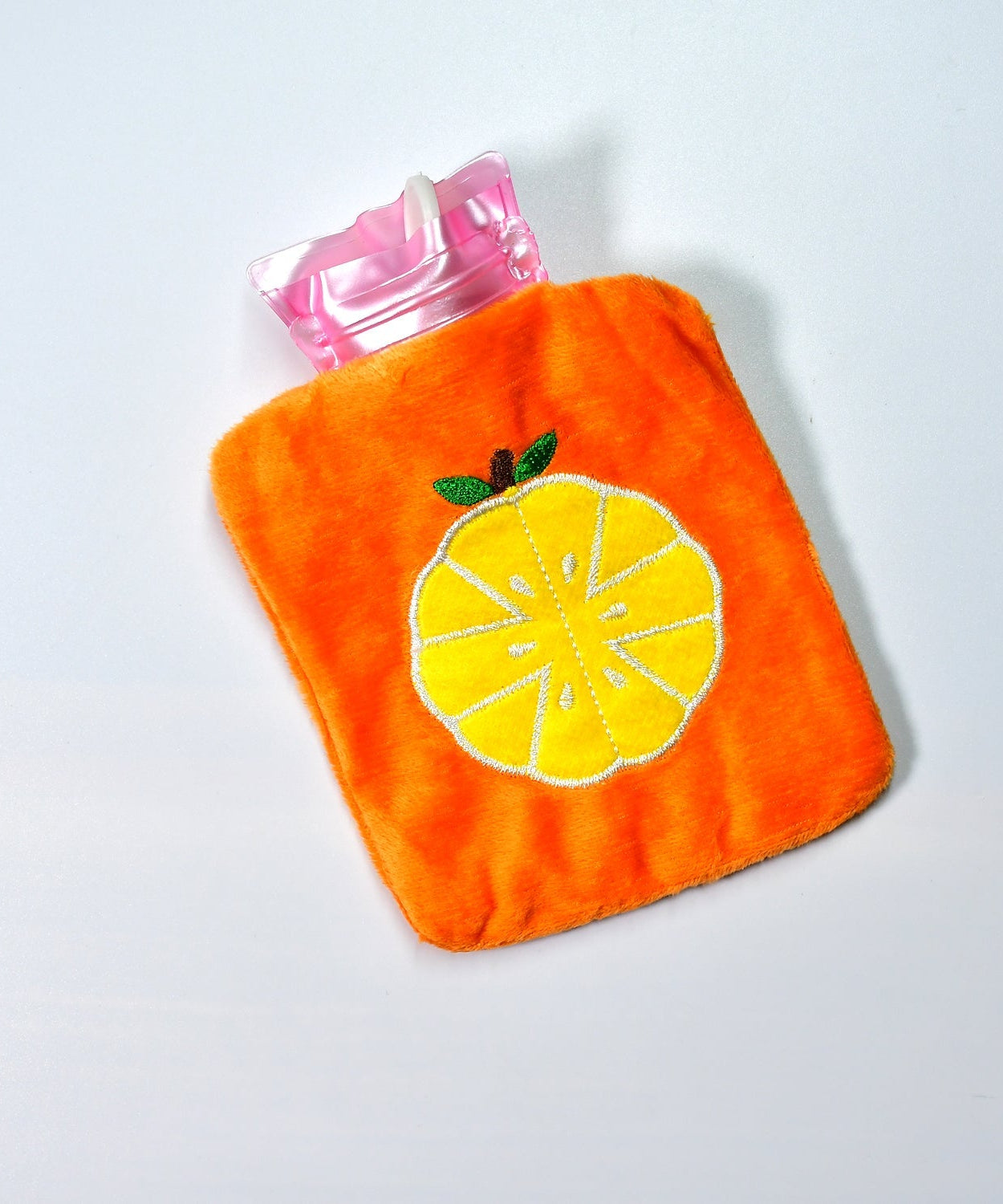 Orange hot water bag with cover for pain relief and warmth