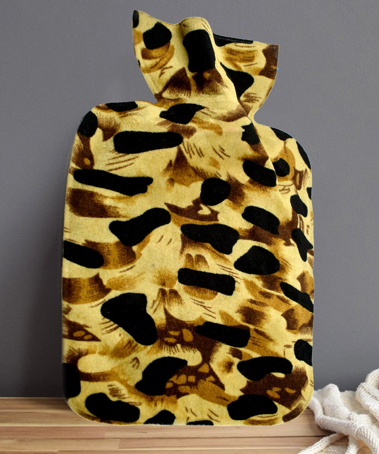 Large rubber hot water heating pad bag for pain relief, demonstrating its size and design