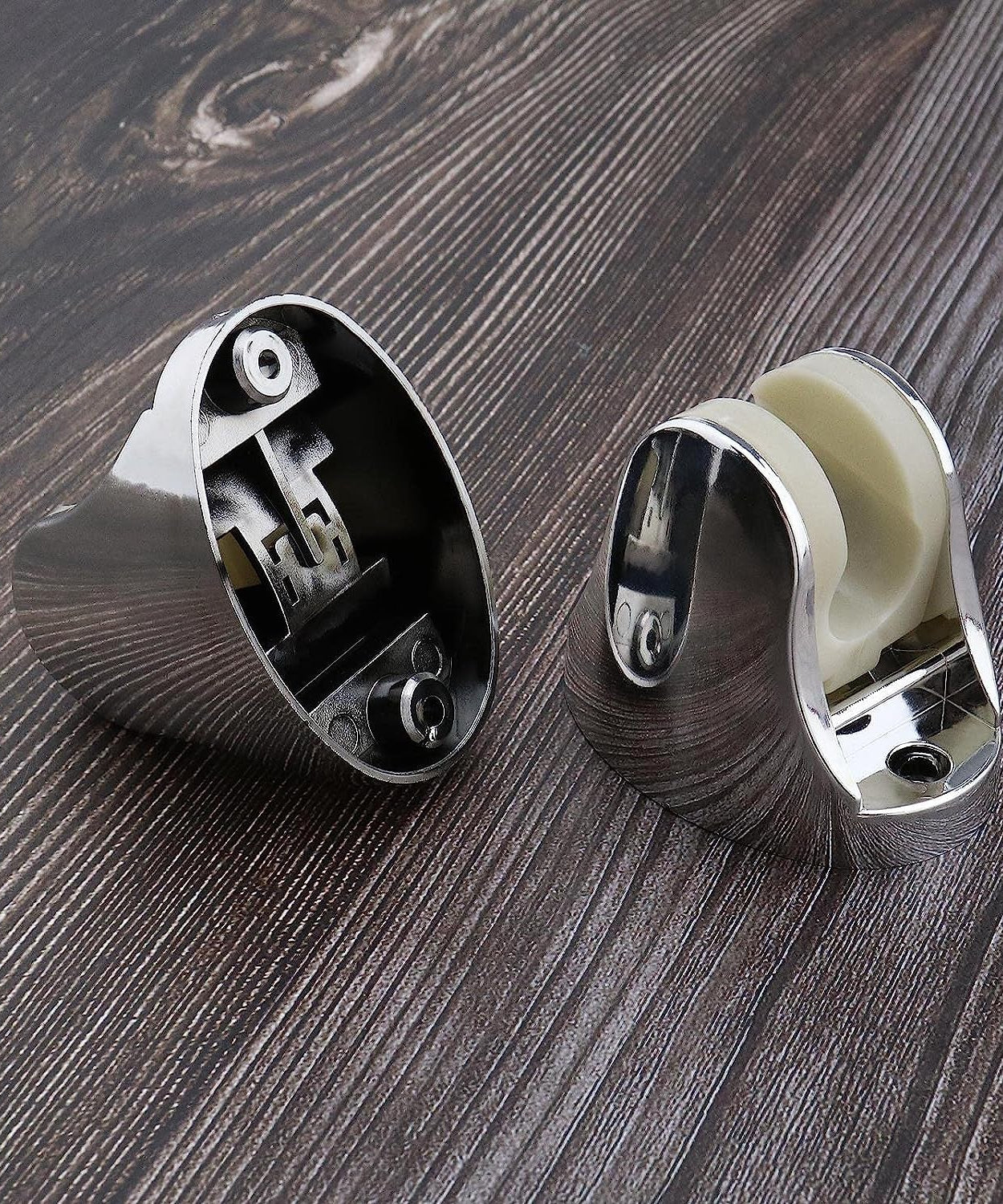 Hand shower holder with adjustable design and included fixing screws for installation.