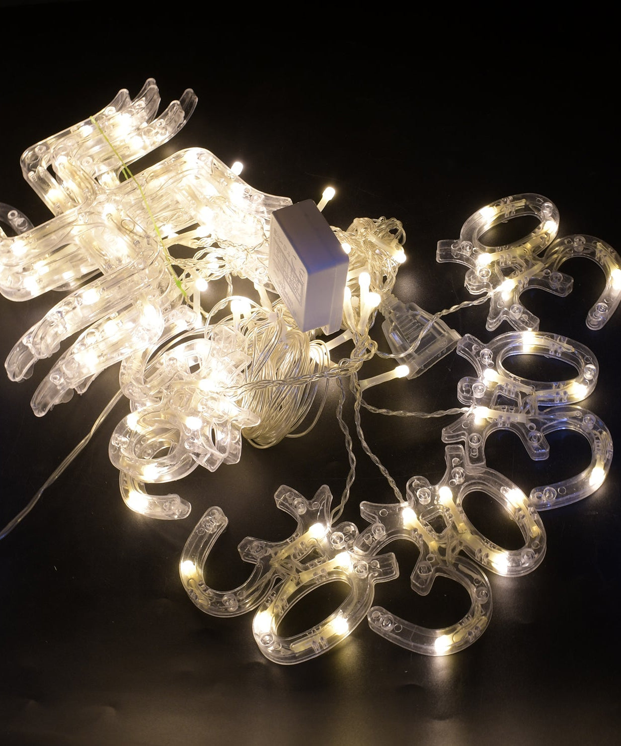 String lights with Swastik and Om symbols for Diwali, showing decorative LED lights.