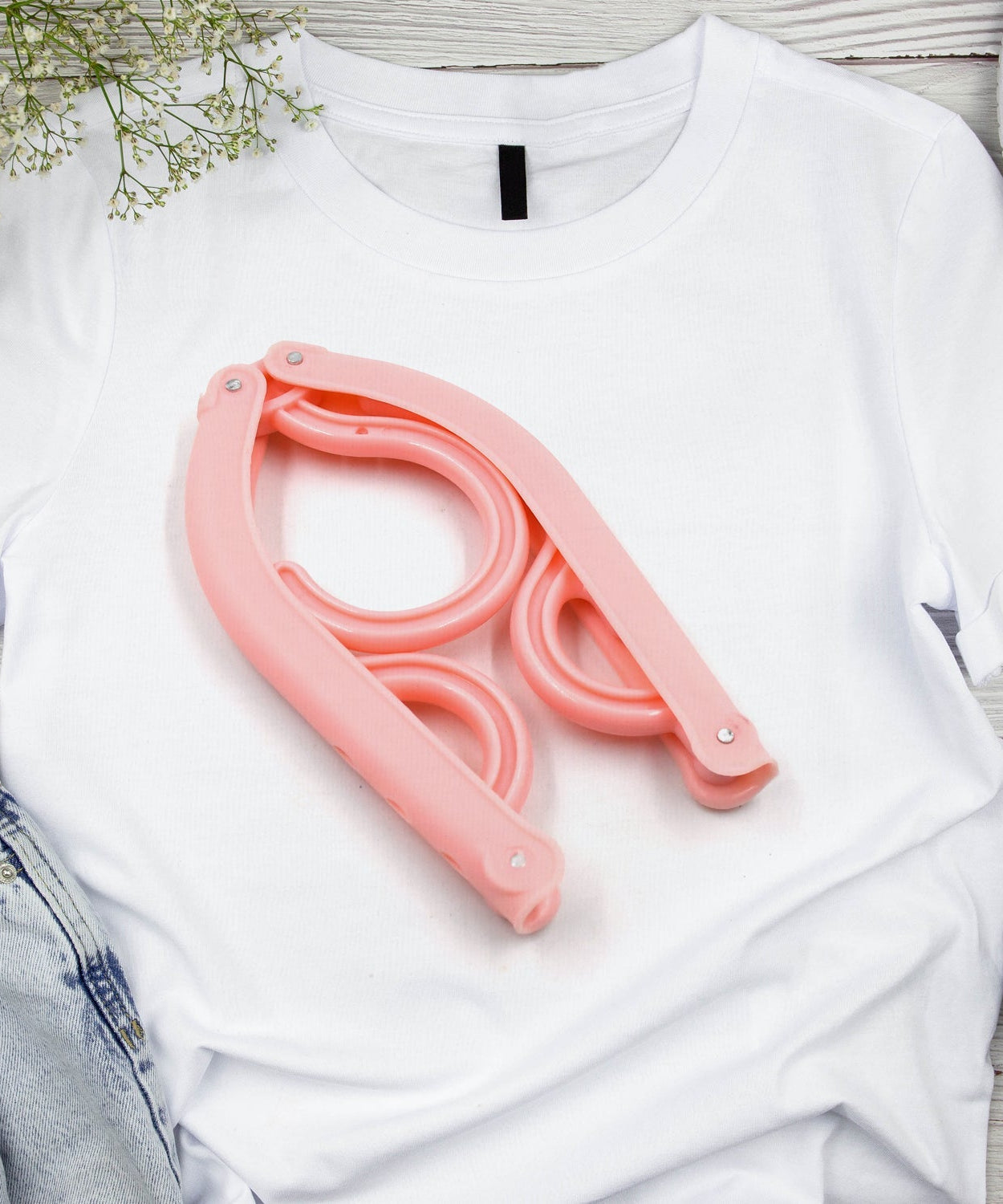 Portable folding clothes hangers for various garments, ideal for travel.