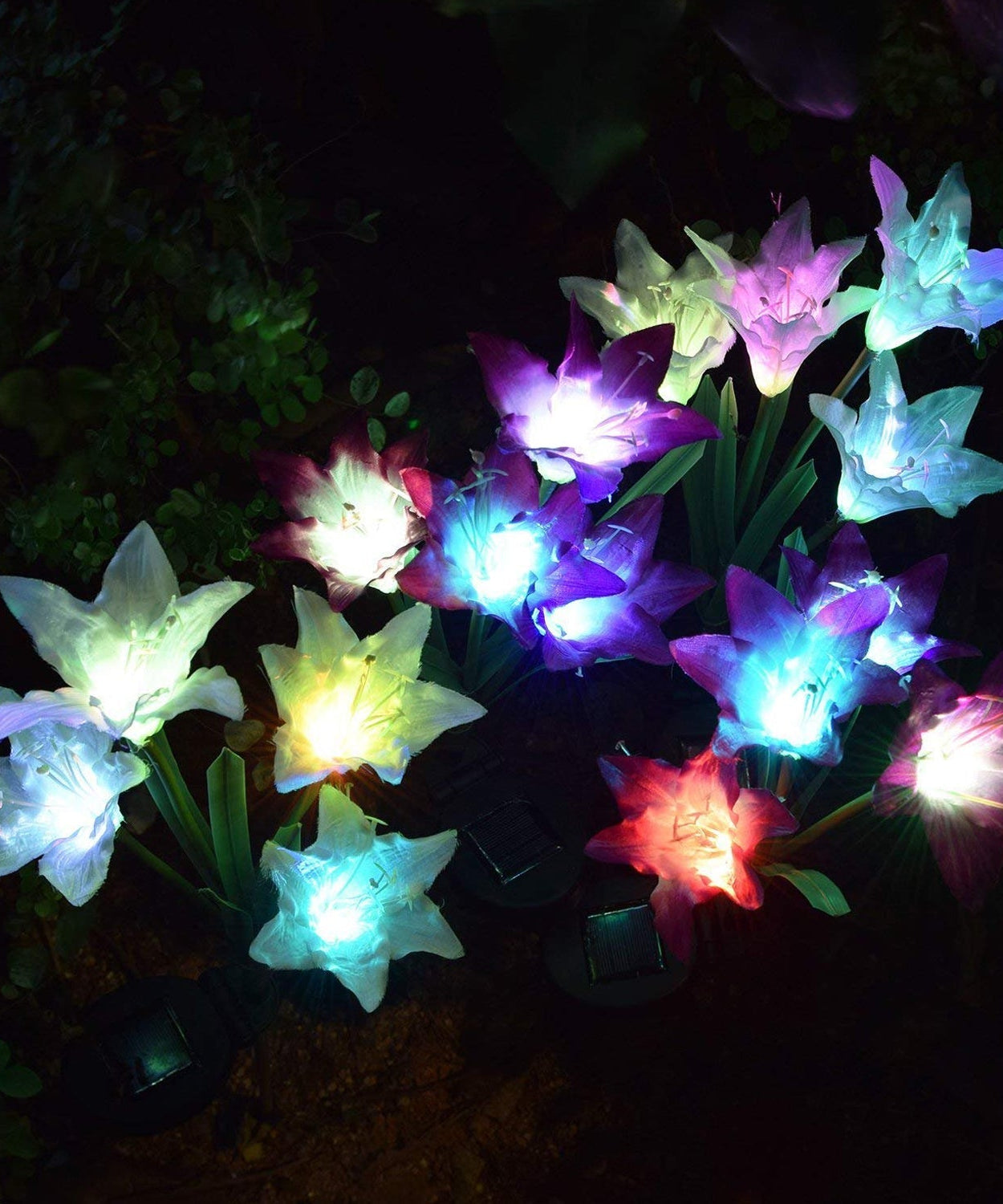 Close-up of solar lily flower stake lights, outdoor decor