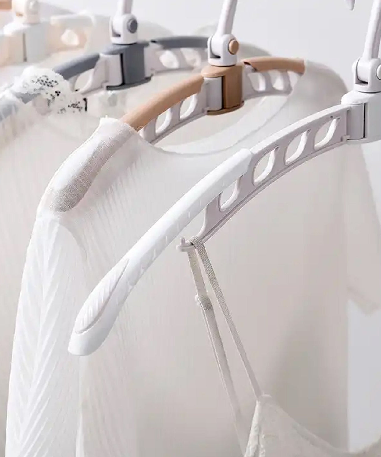 Adjustable portable folding clothes hanger with 360° rotation, ideal for travel