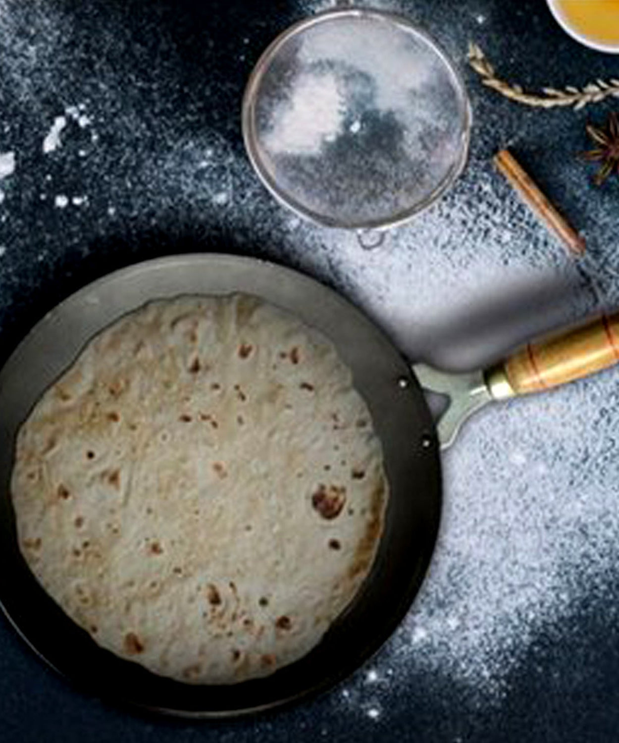 Wooden handle tawa with nonstick coating, perfect for home kitchens.