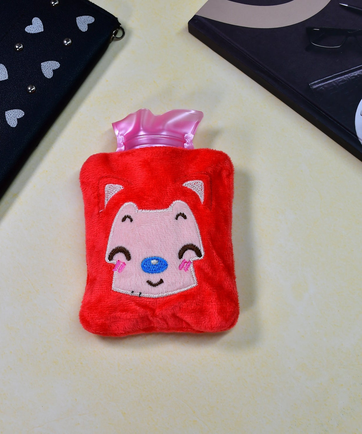 Pink cat hot water bag with cover for soothing menstrual cramps