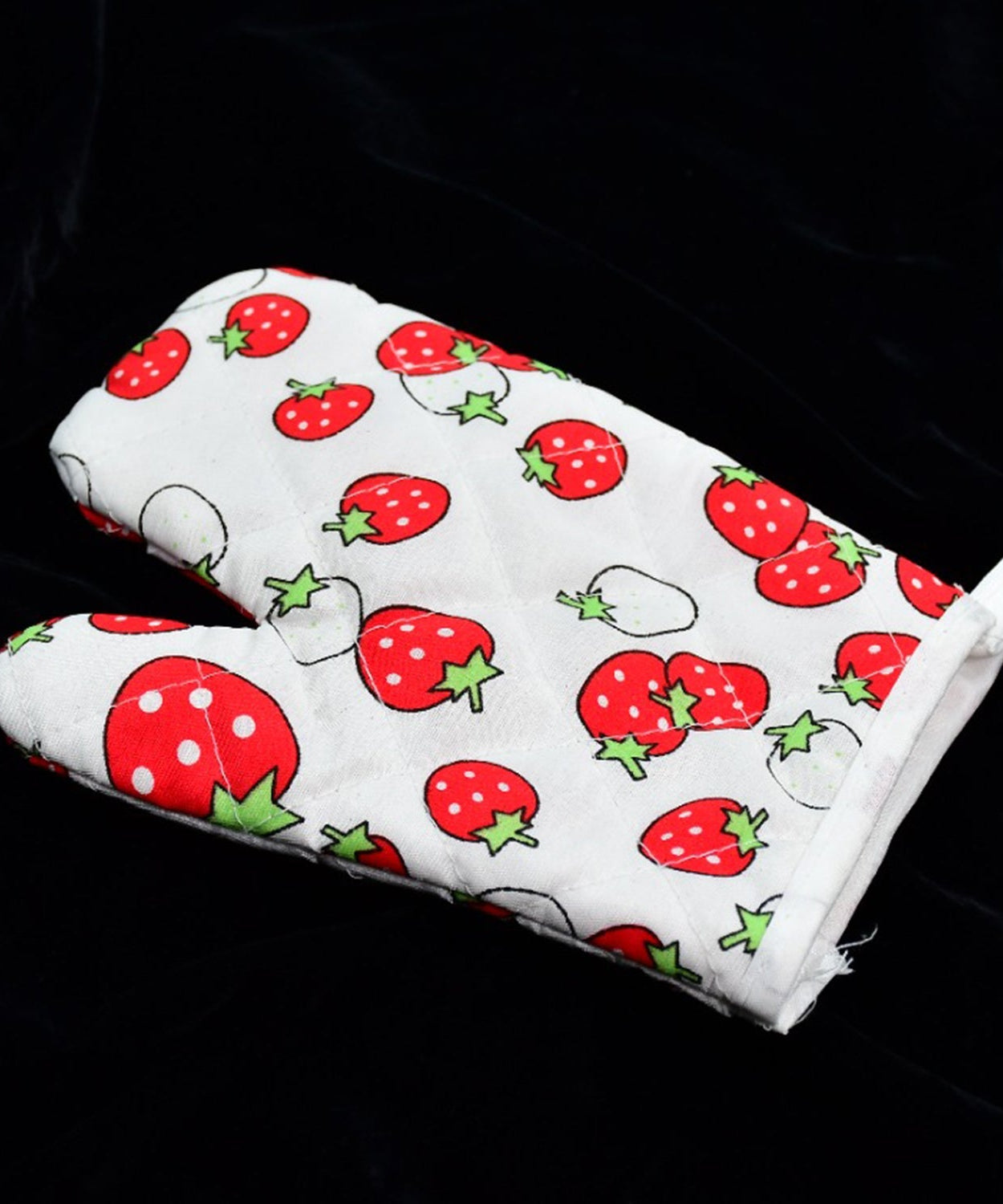 Colorful designer oven mitt and pot holder set, perfect for kitchen use.