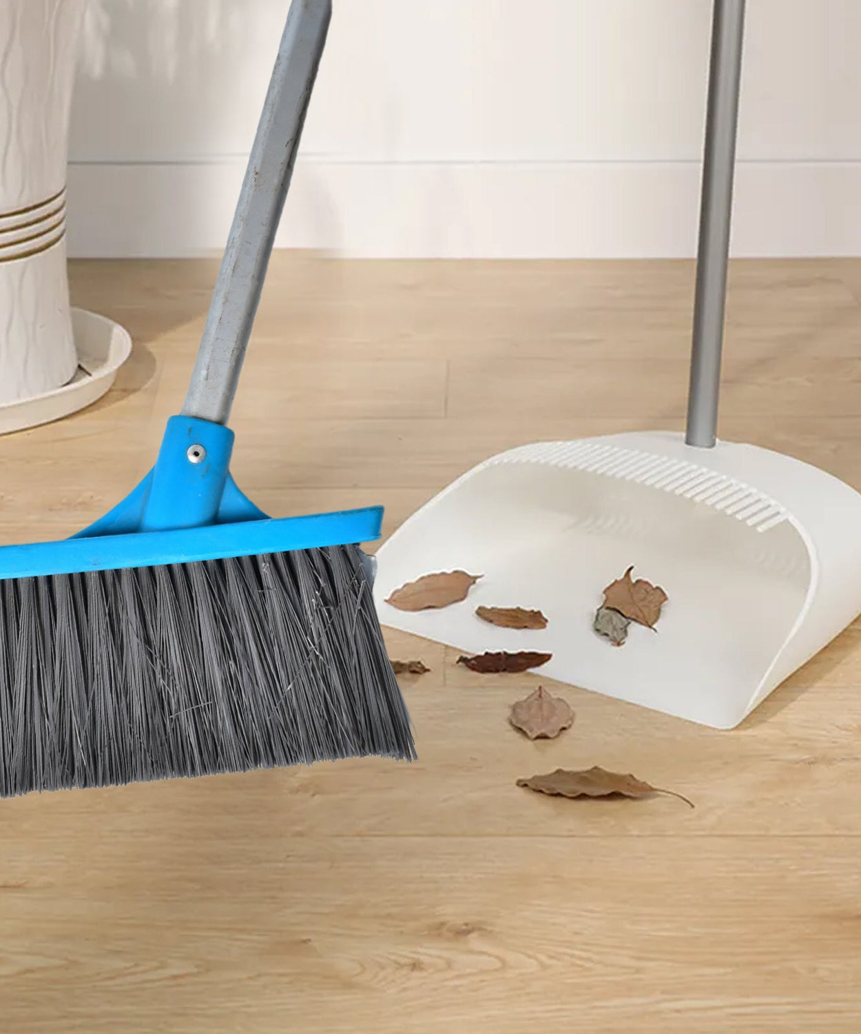 Floor scrub brush with long handle and stiff bristles for effective cleaning.