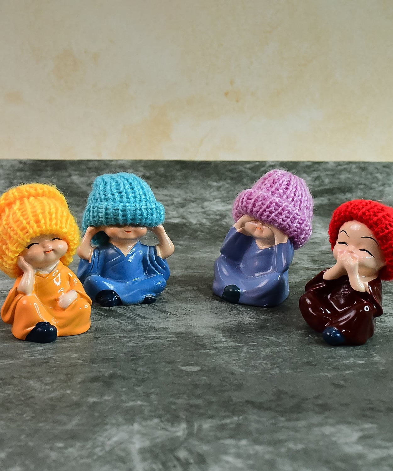 Decorative Resin Monk Buddha Showpiece Set of 4 with Traditional Straw Hats