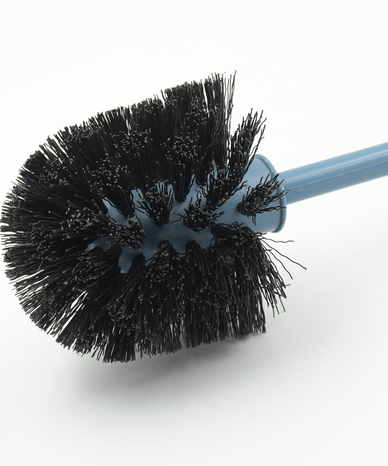 Round toilet brush in holder for neat storage