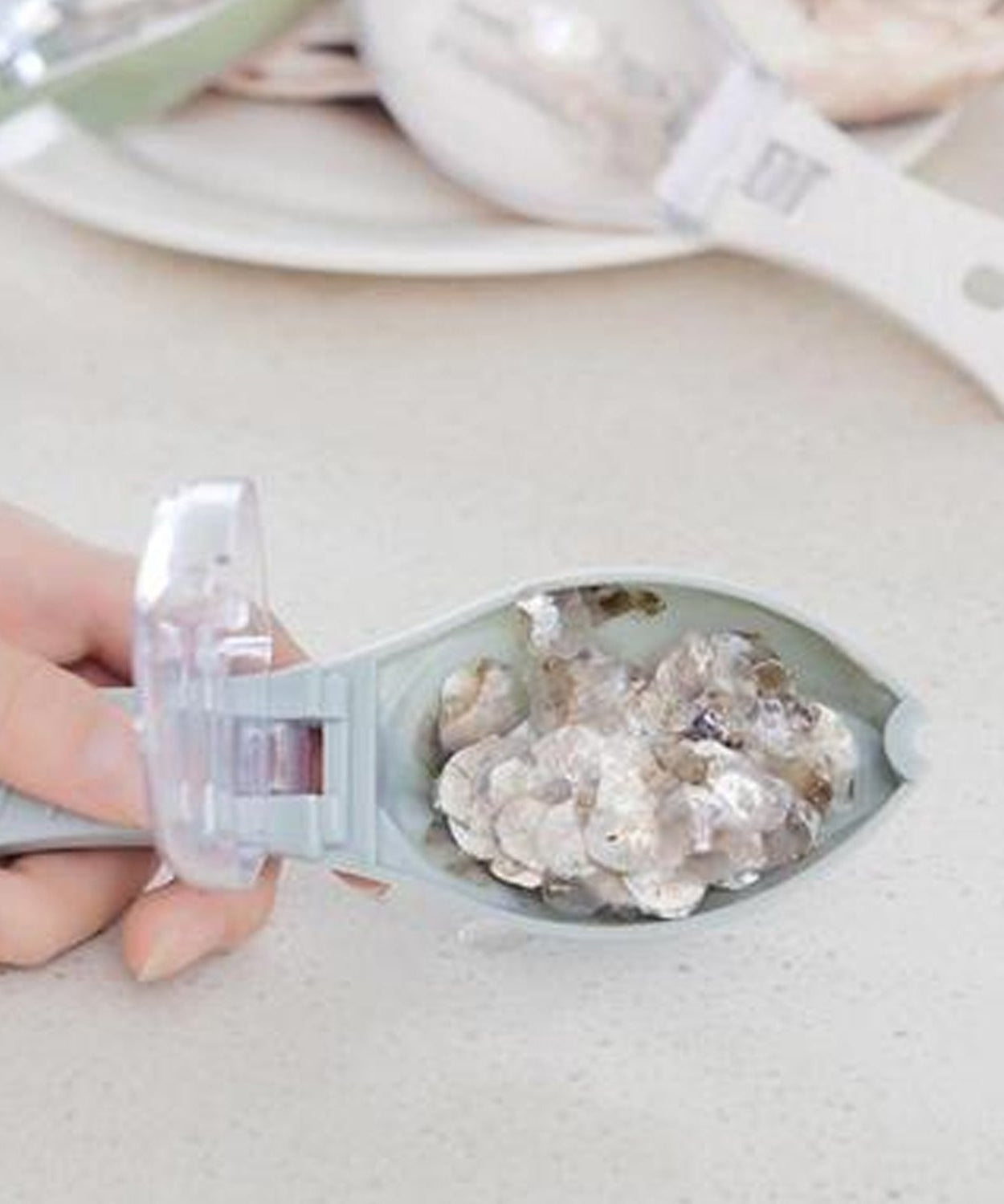 Kitchen tool for cleaning fish scales with ease.