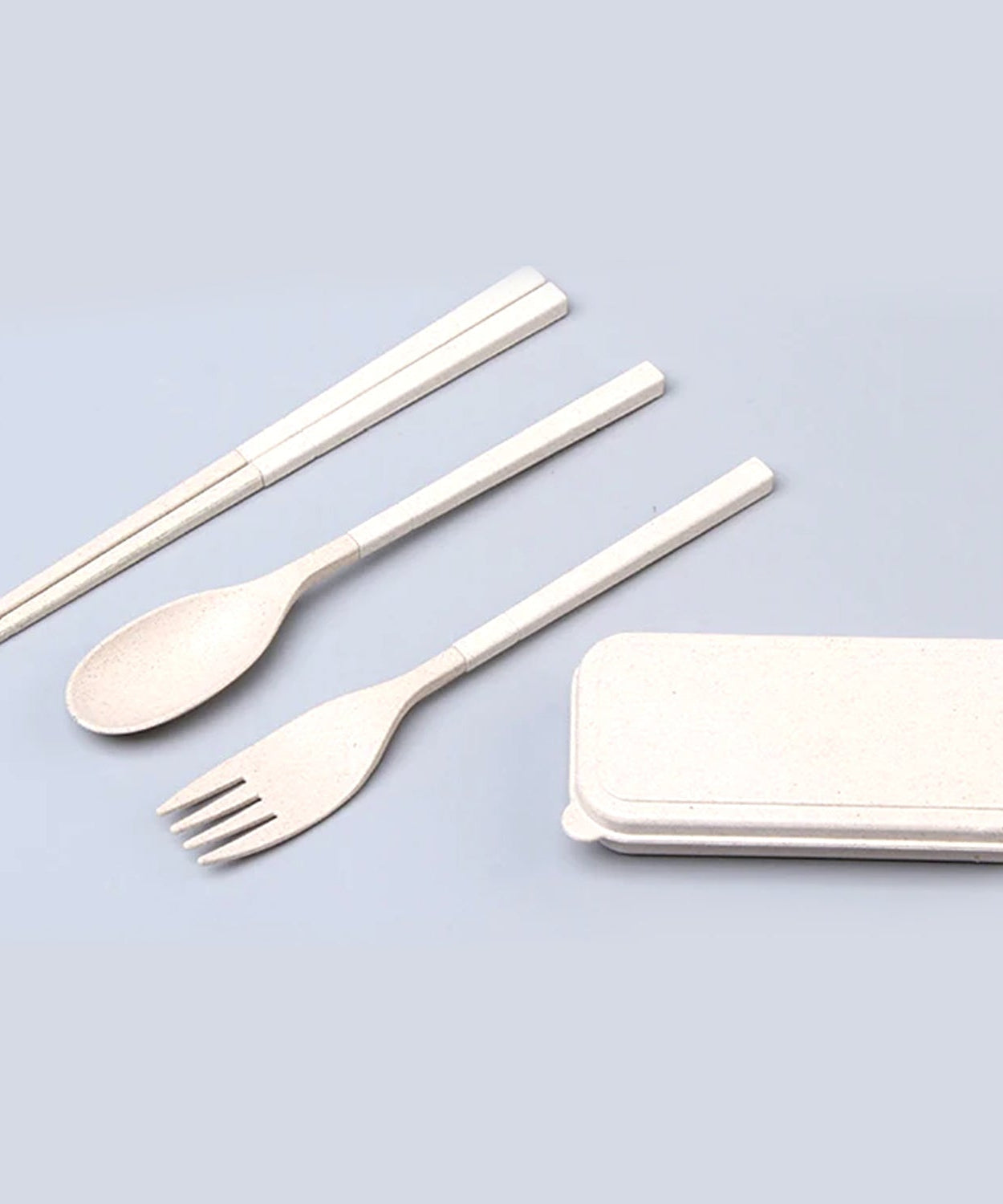 Cutlery set with spoon, fork, and chopsticks.