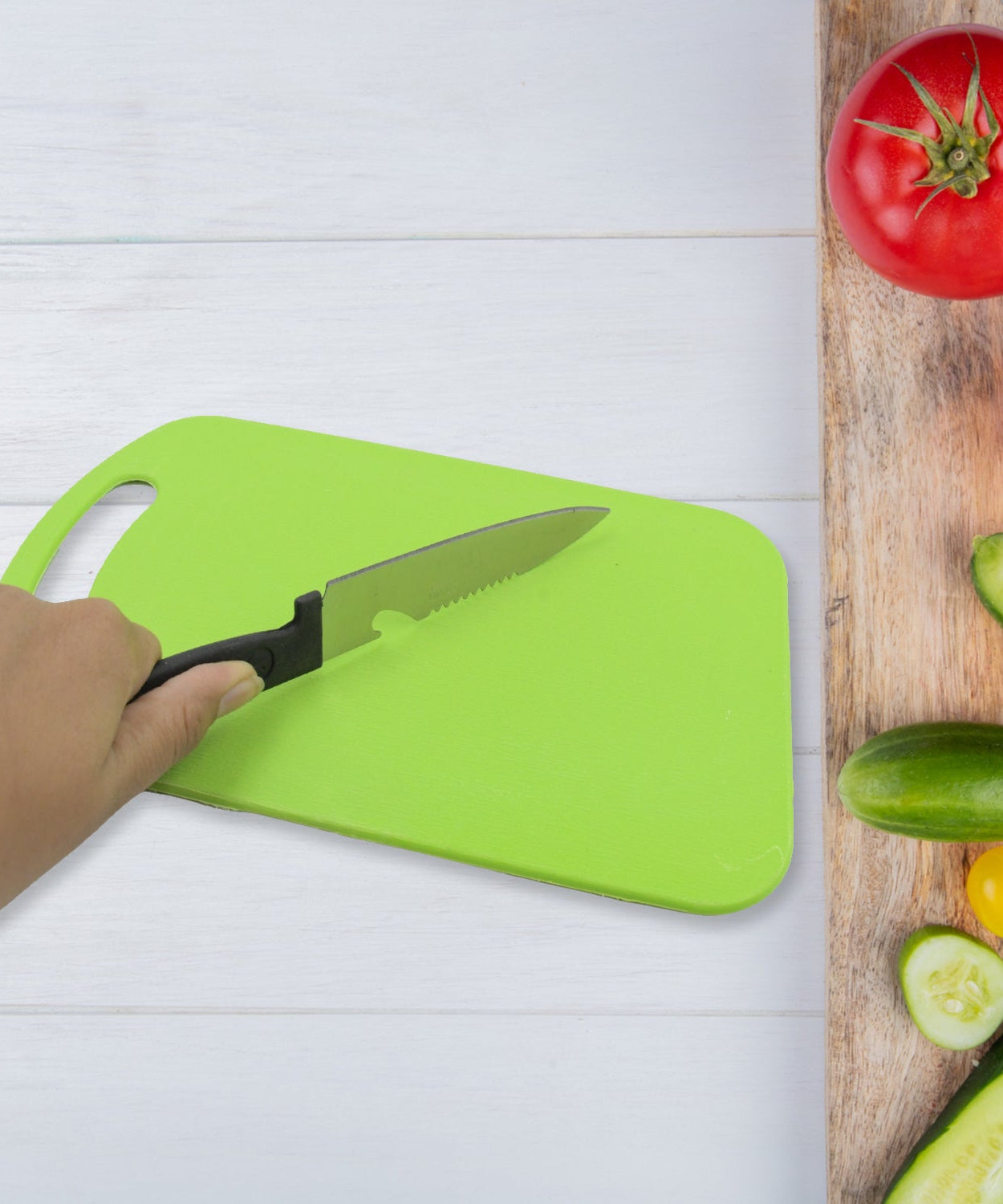 Set of plastic chopping board and steel knife for kitchen tasks
