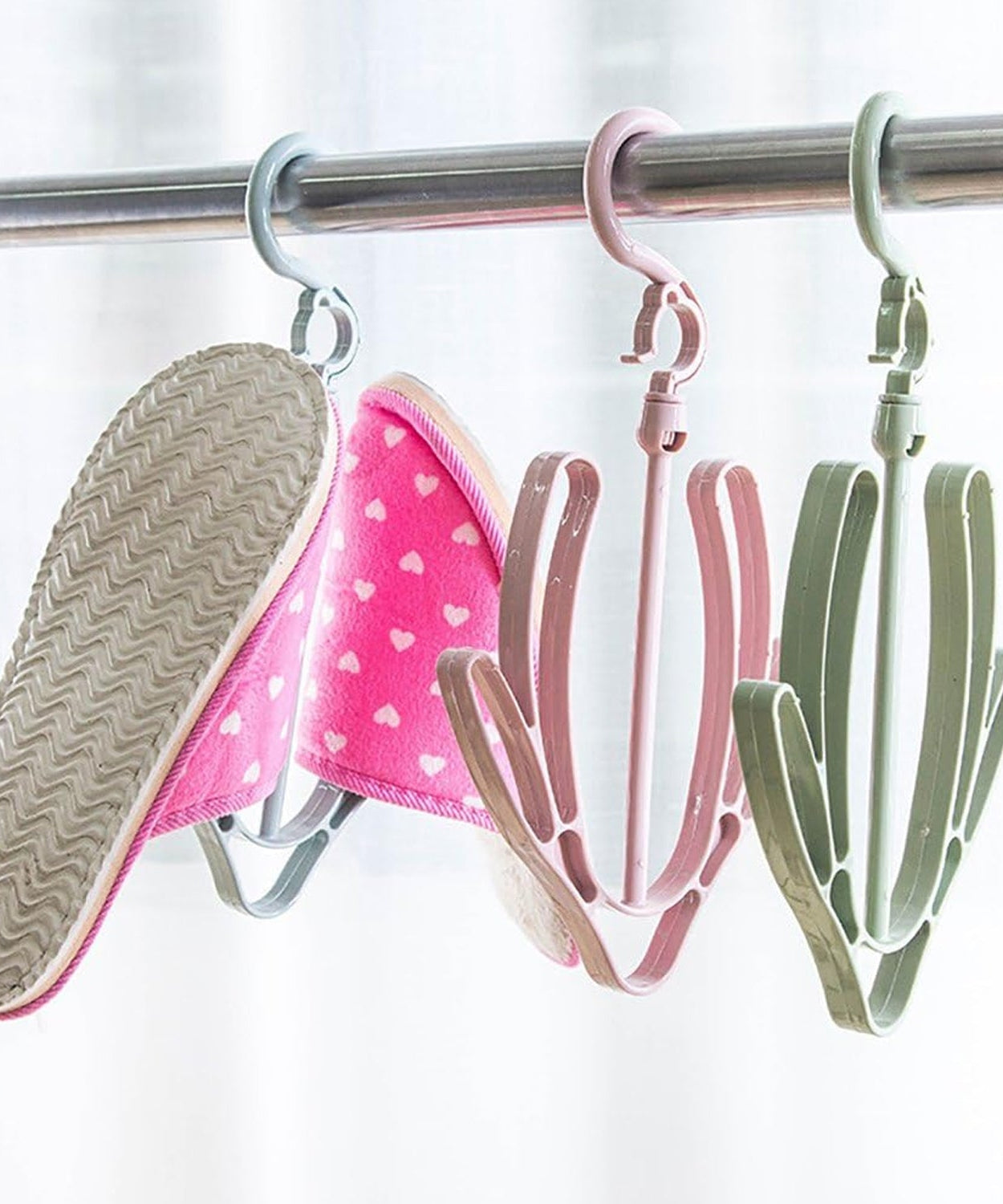 Shoe drying hanger, rotatable and ideal for hanging shoes in various settings.
