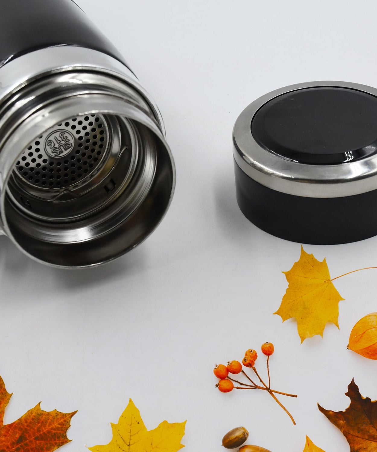 Flask with detailed view of stainless steel exterior and insulation.