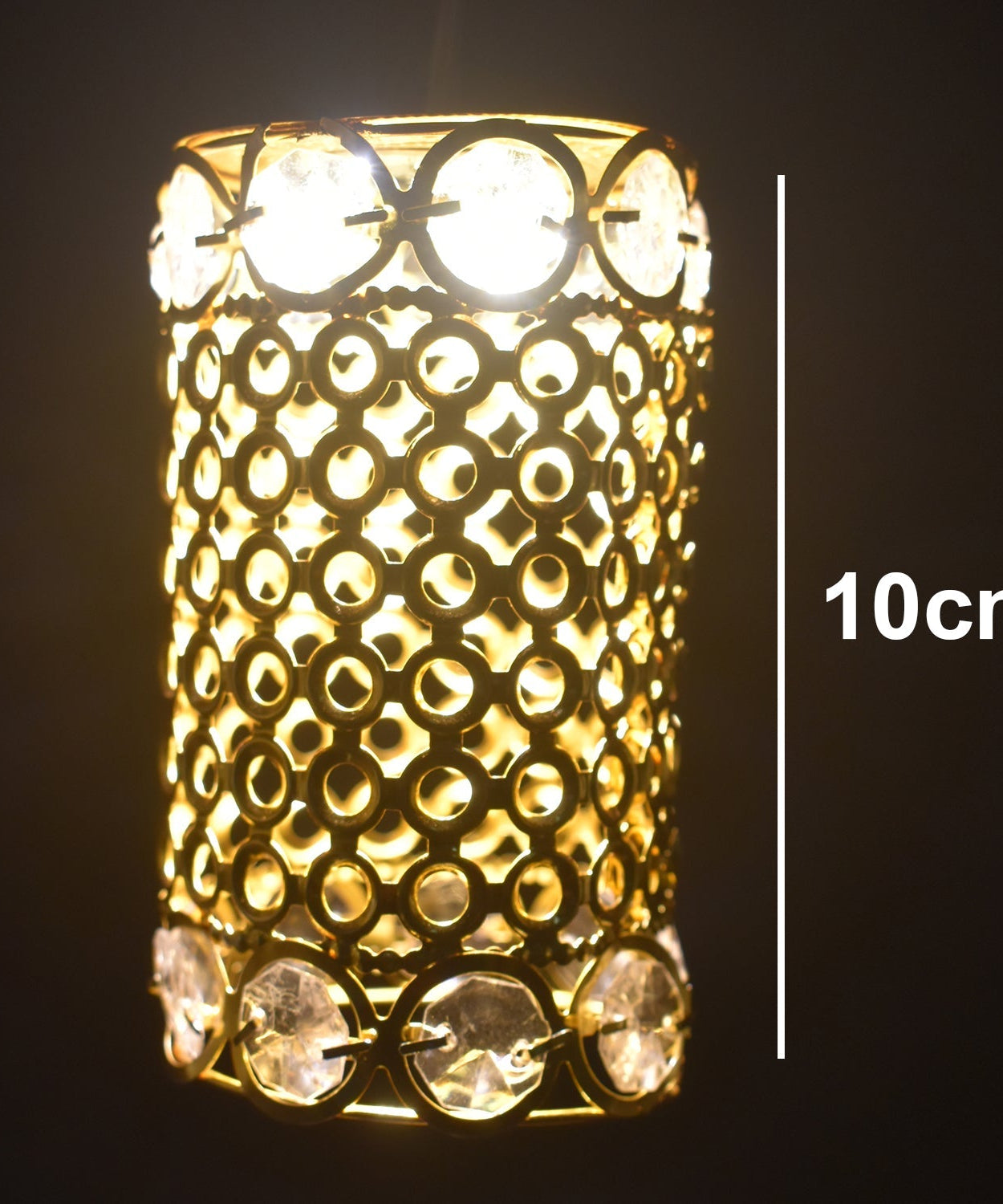 Large golden decorative jhoomer with diamond details.
