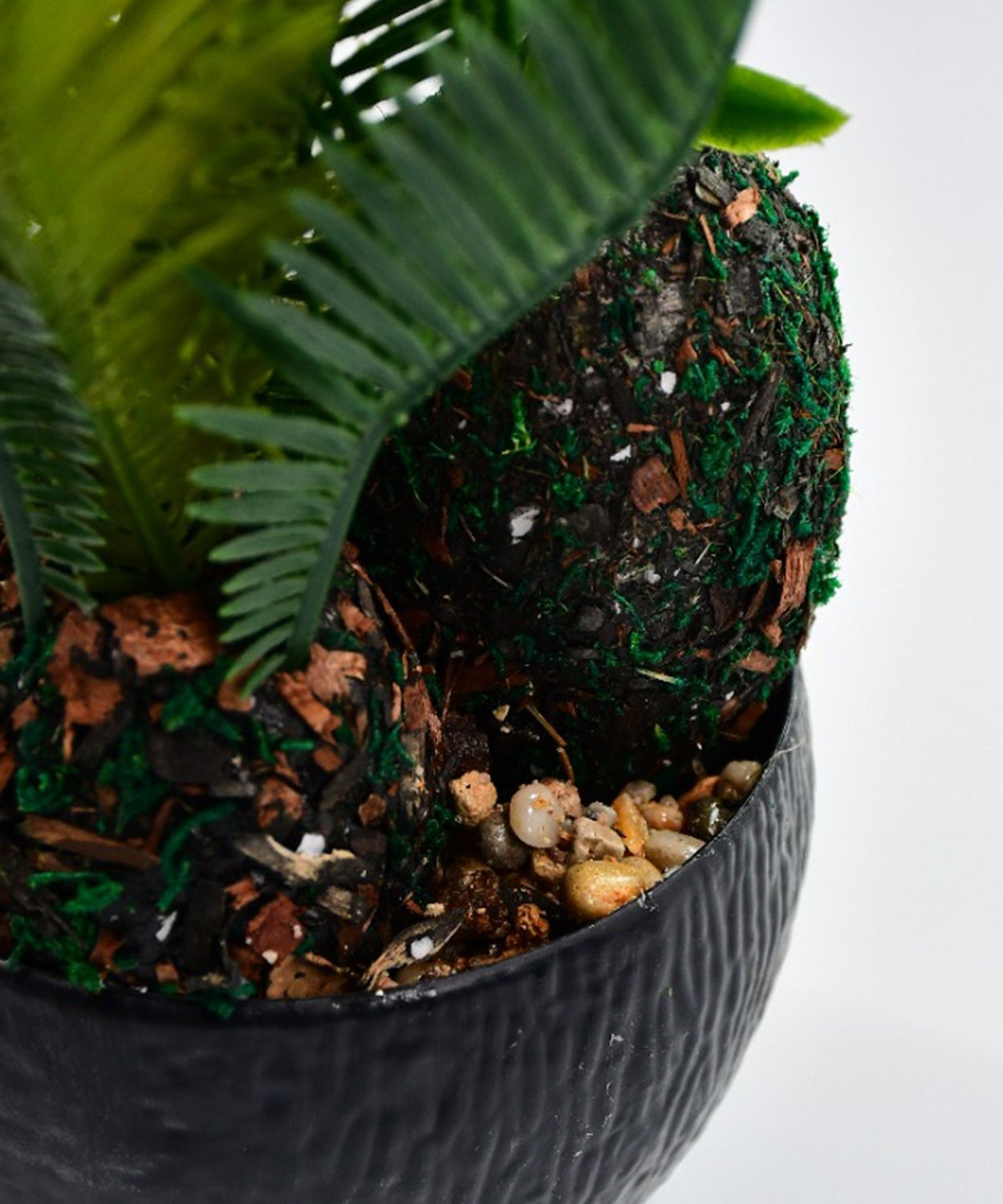 Pot with artificial plant and realistic appearance