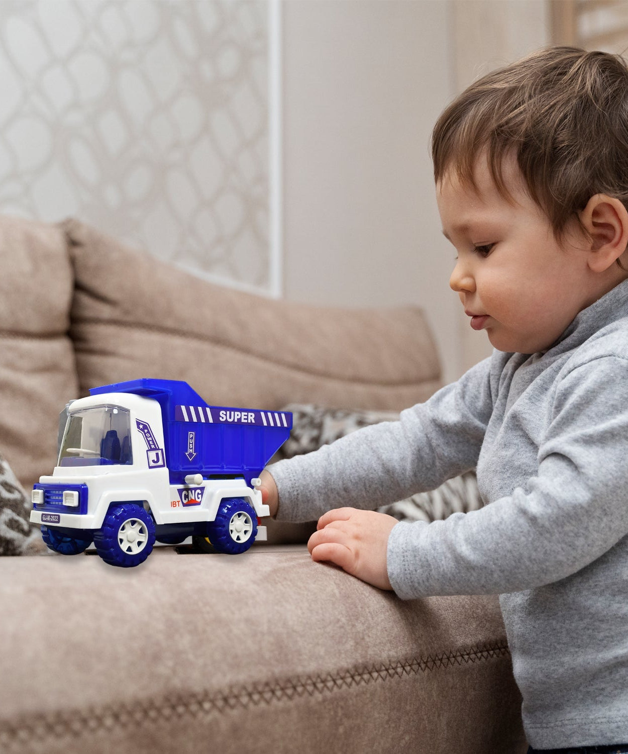 Plastic toy truck with friction drive and container