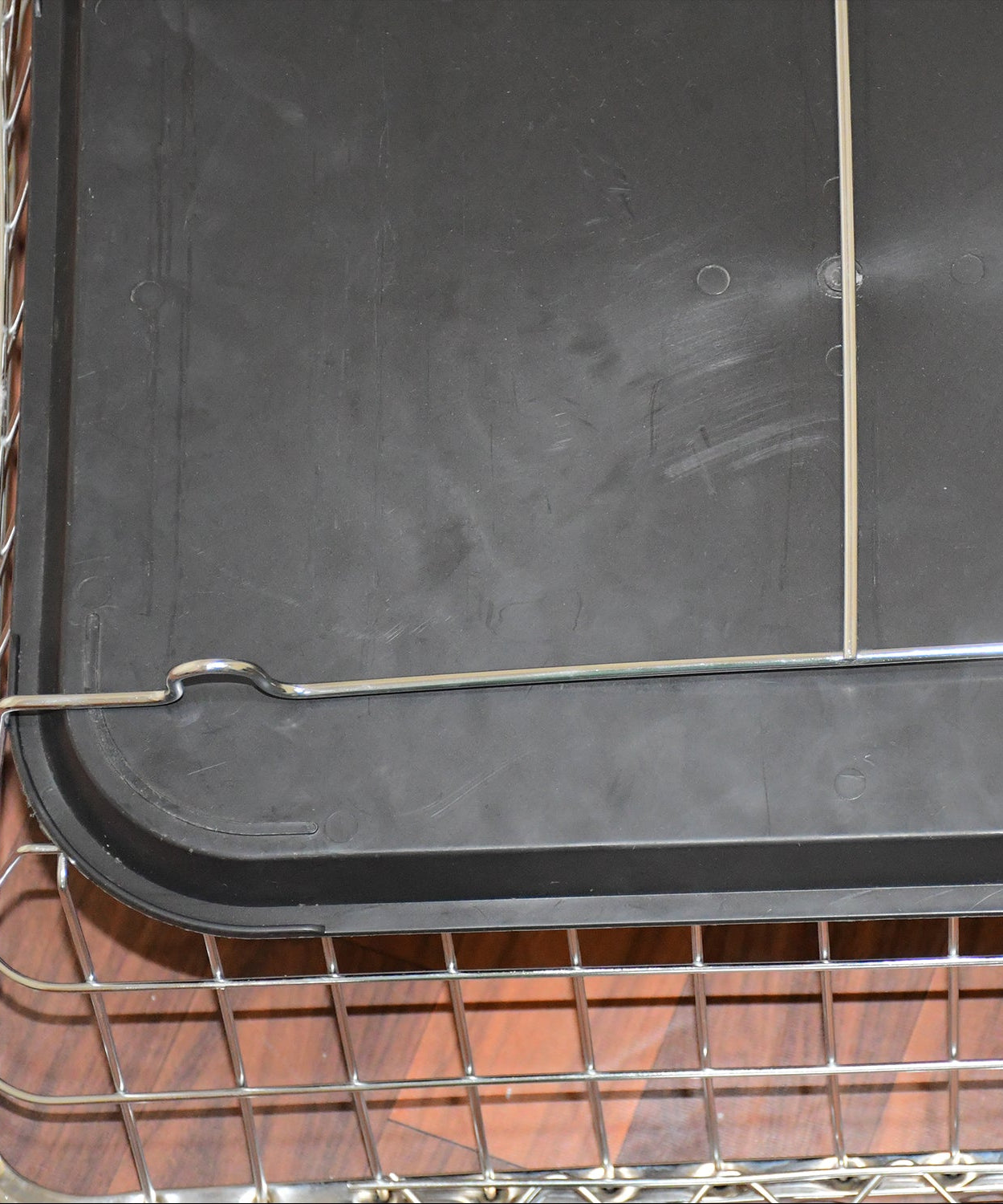 Stainless steel dish rack with drip tray for organizing kitchen utensils