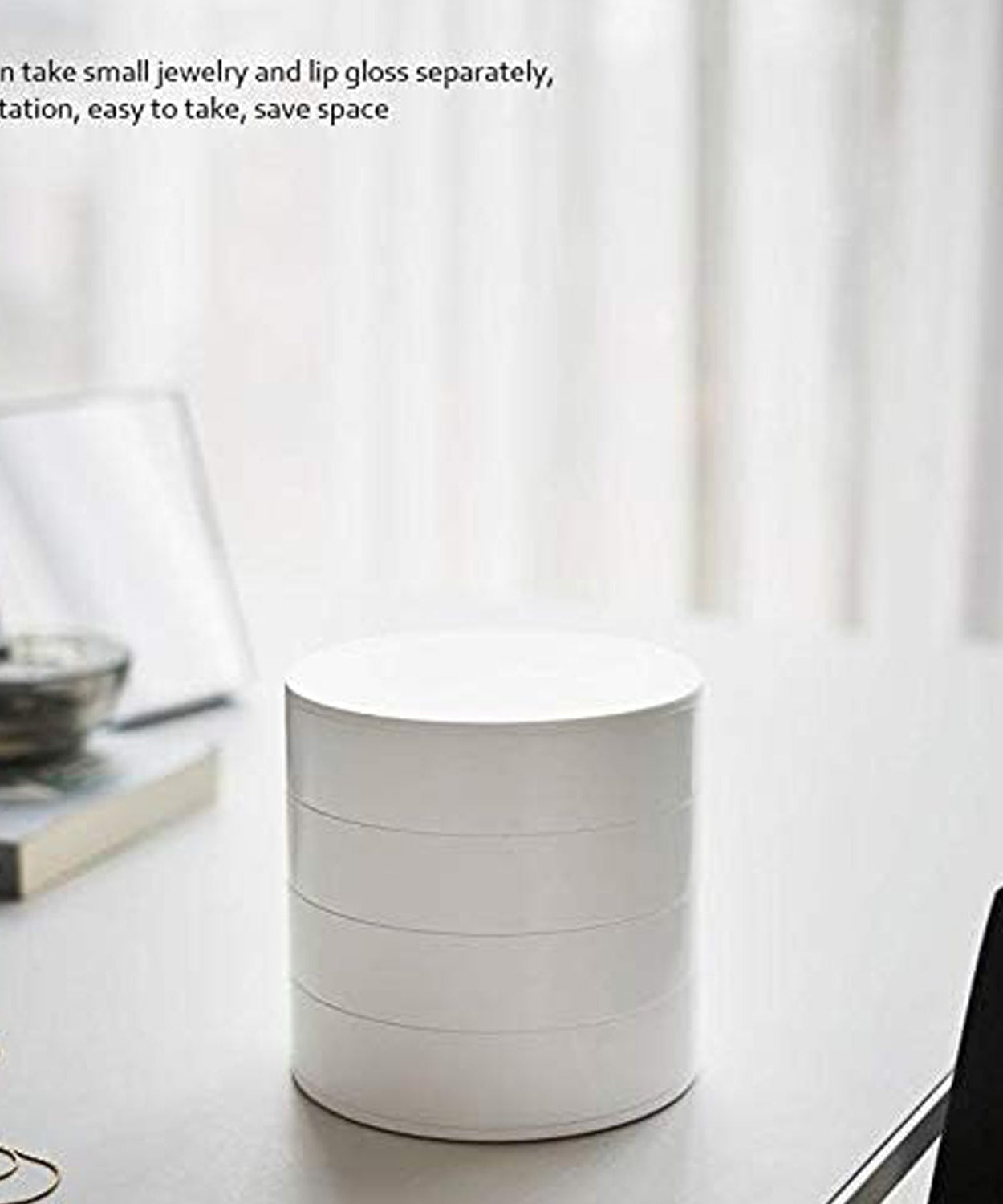 360-degree rotating jewelry organizer with mirror and multiple compartments.