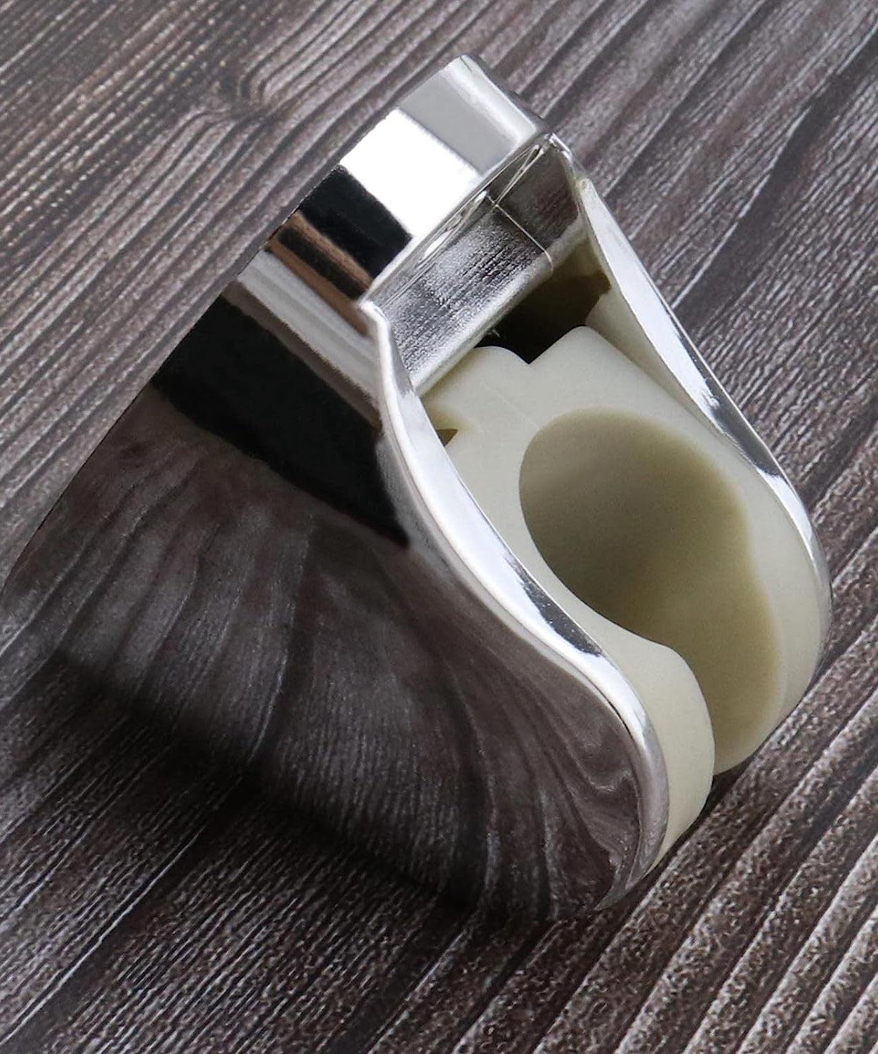 Hand shower holder with adjustable bracket, includes screws for secure bathroom installation.