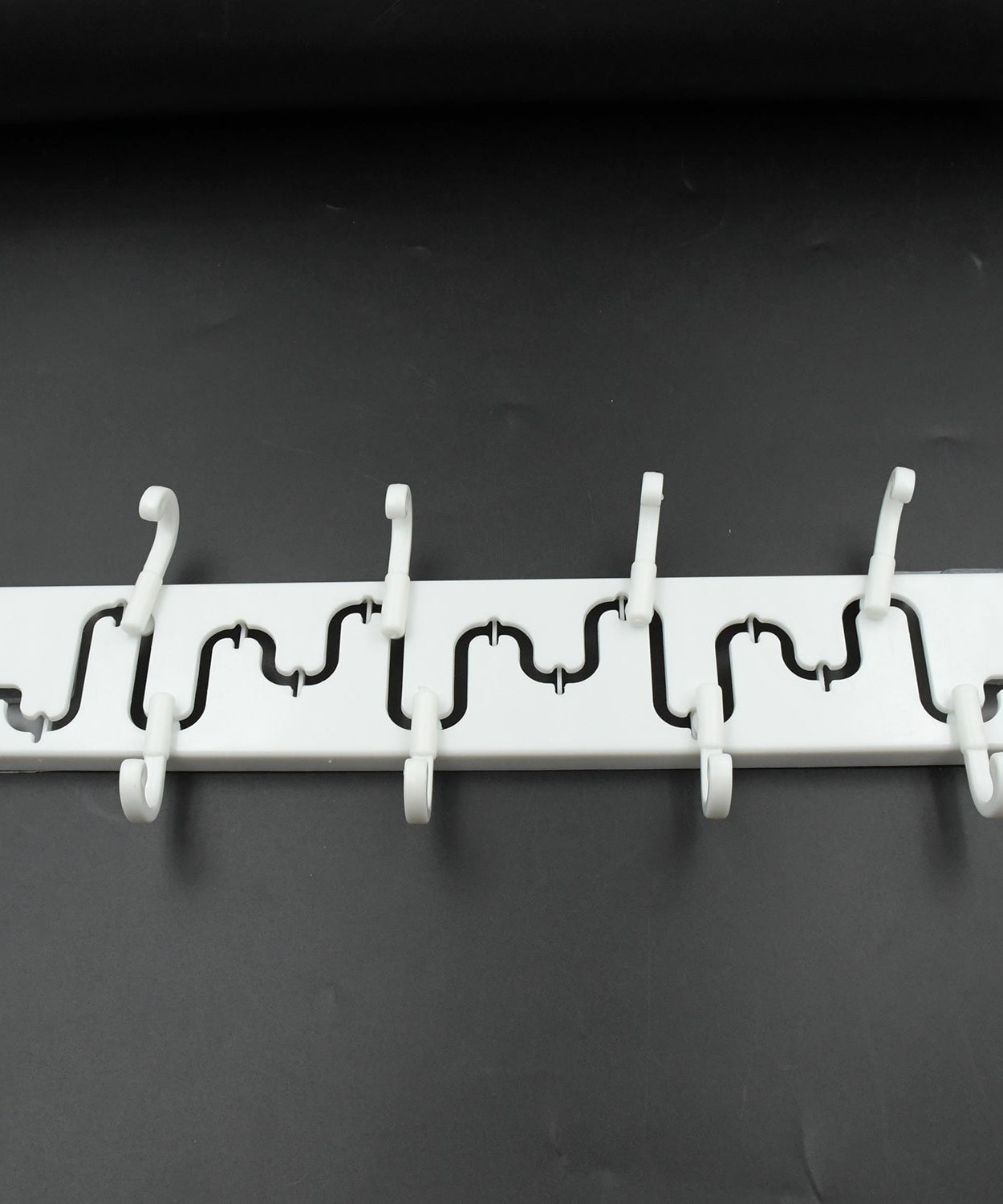 Adjustable wall hook with sliding mechanism for easy reach