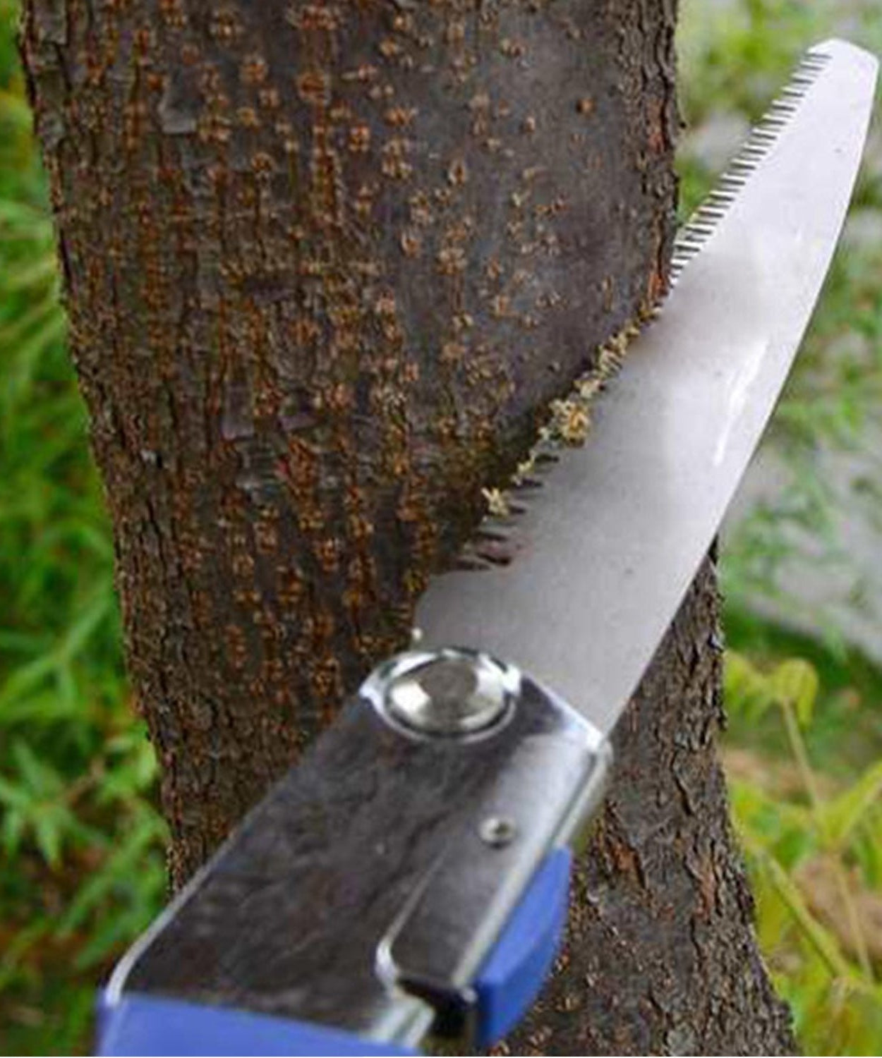 Multi-purpose saw with ergonomic handle and folding mechanism