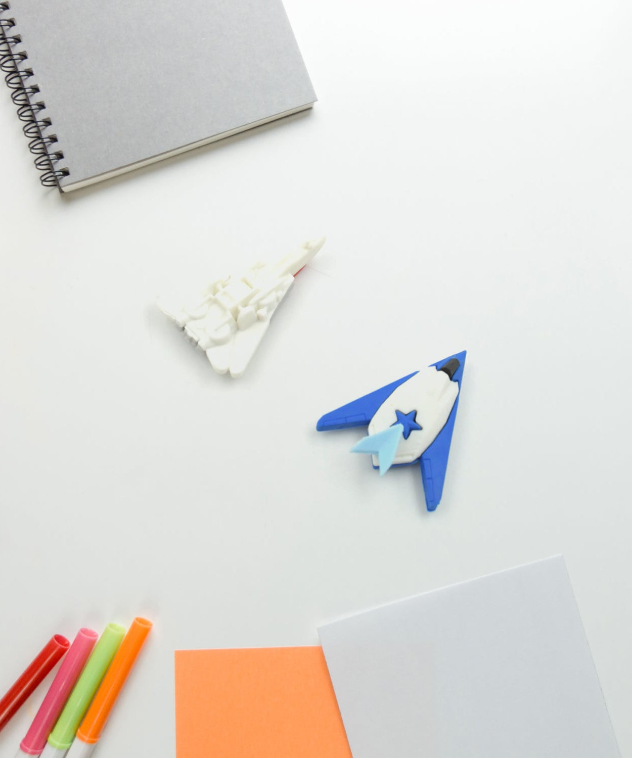 Colorful gun and plane-shaped erasers for children