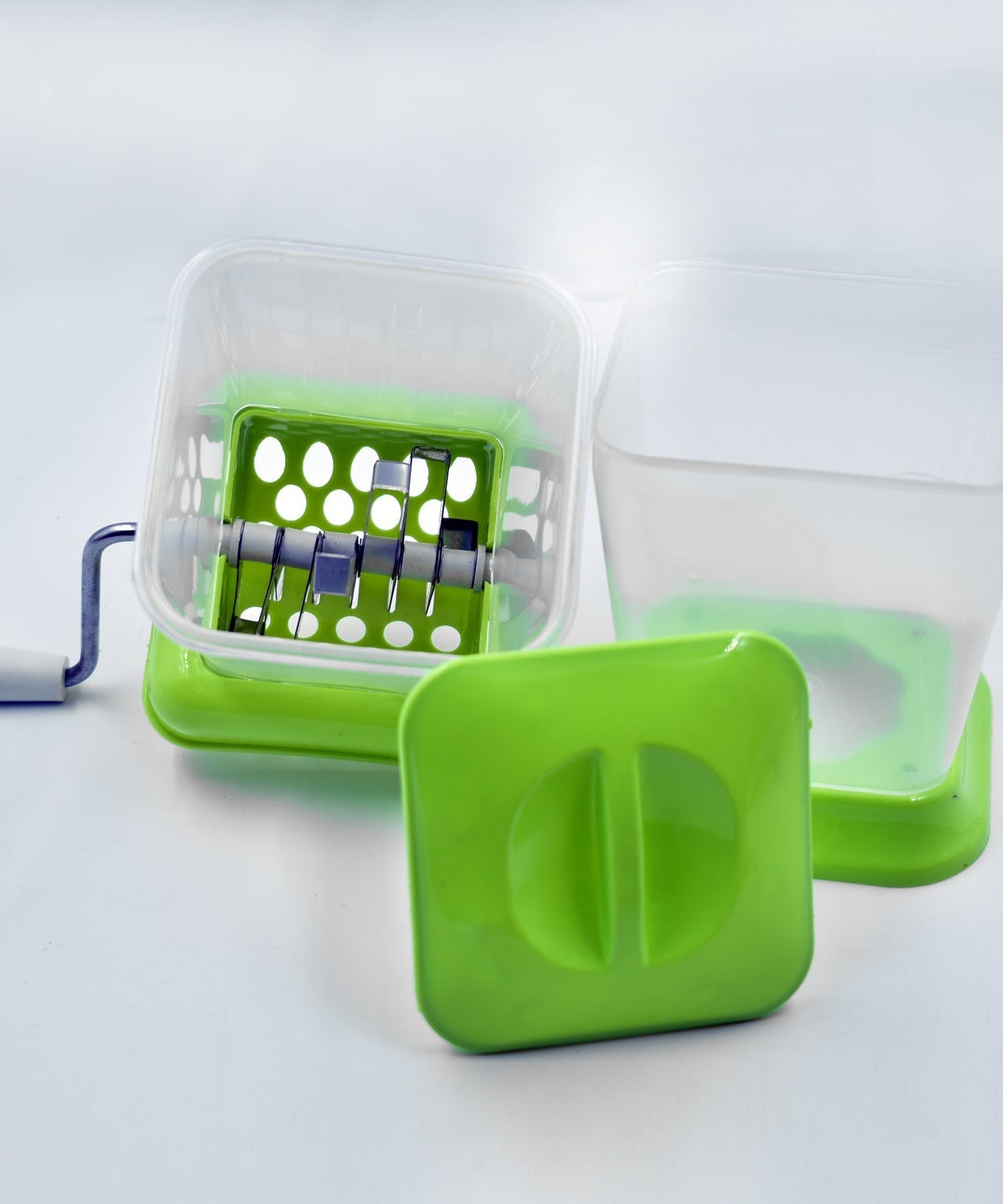 Vegetable cutter with rotating blade for chopping onions easily.