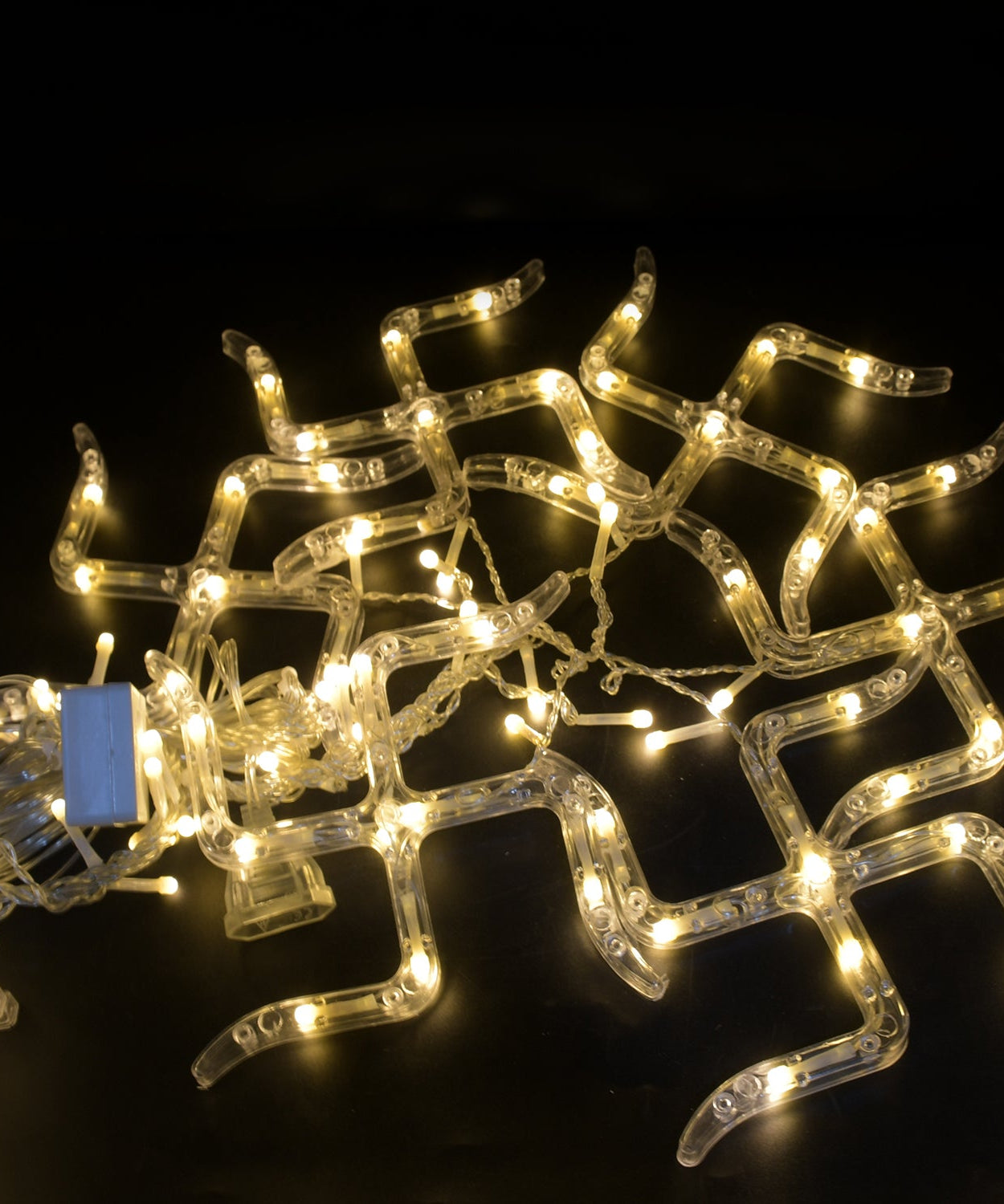 Detailed view of the decorative string lights with hanging props for festive decoration.